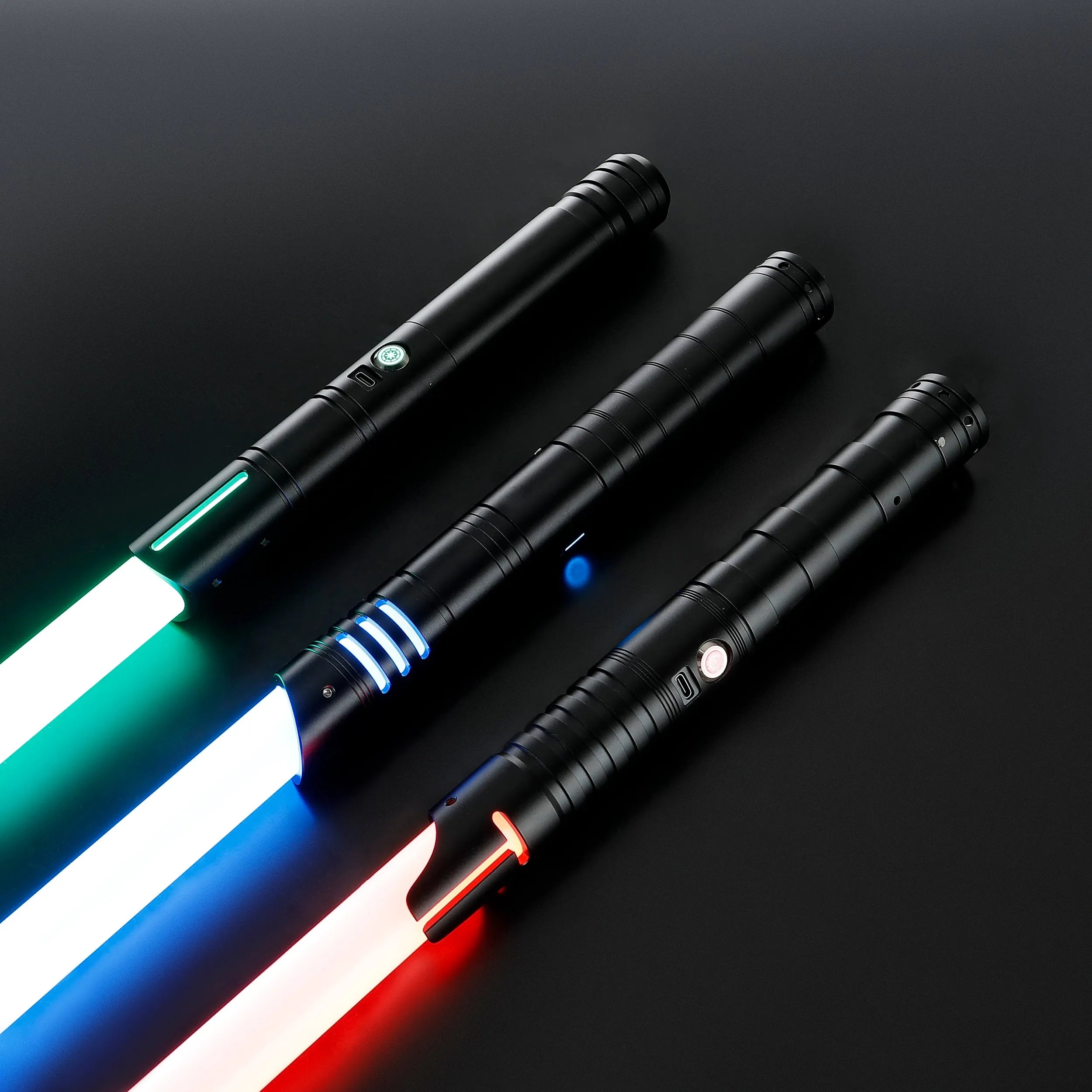 Three black T6 aluminum alloy dueling sabers with glowing green, blue, and red blades.