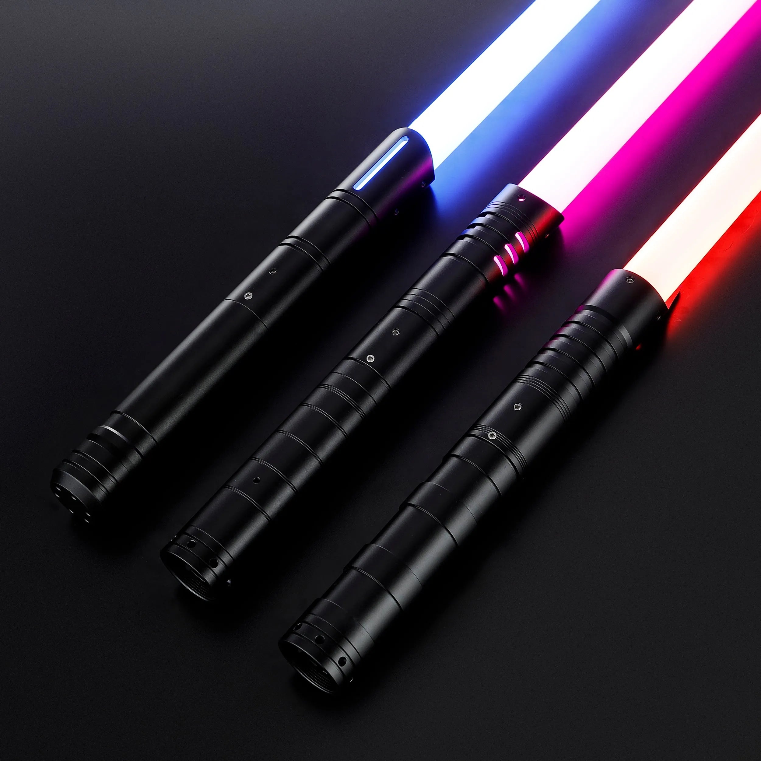 Three black T6 Aluminum Alloy dueling sabers with glowing white, blue, and red blades.