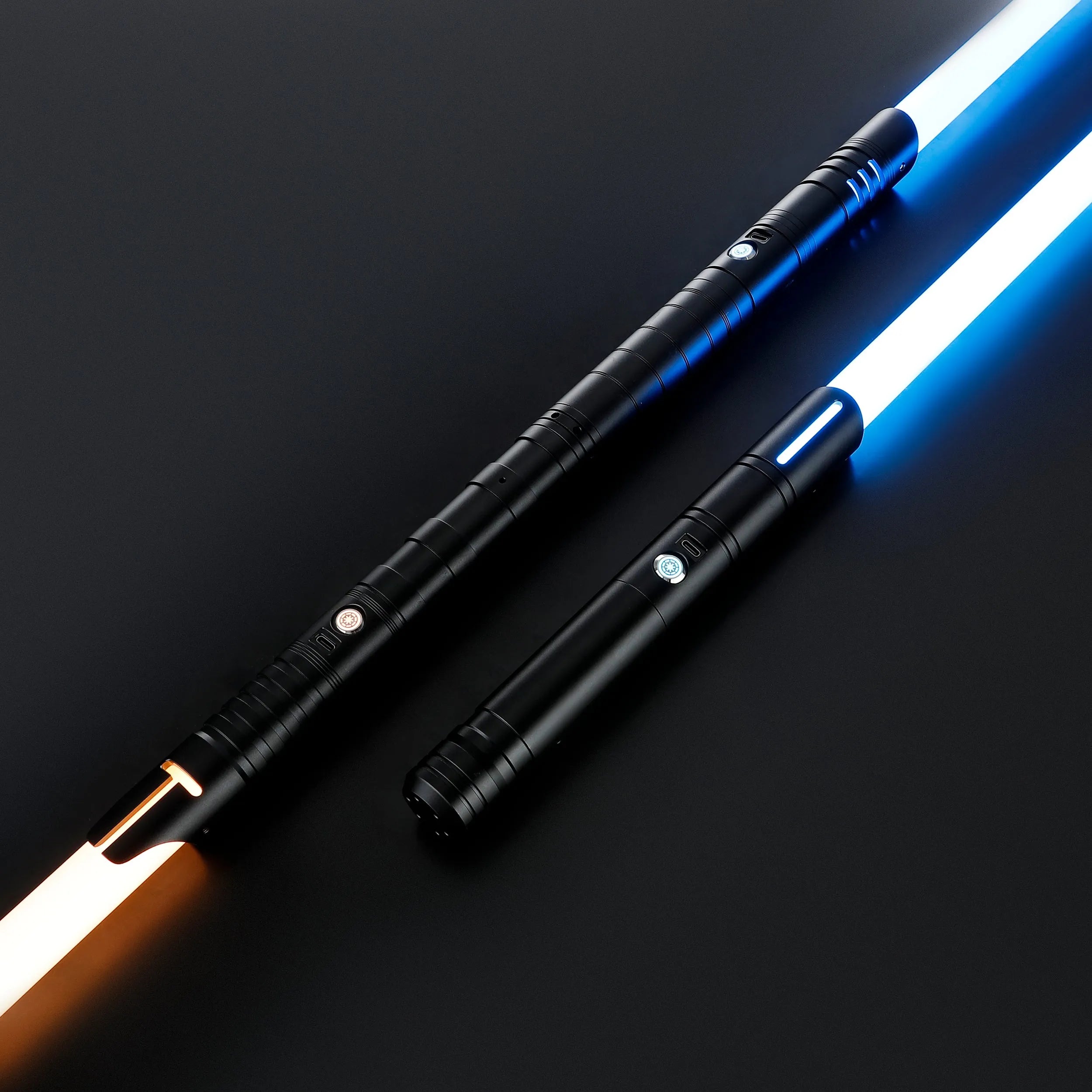 Two black T6 Aluminum Alloy dueling sabers with glowing orange and blue blades on a dark background.