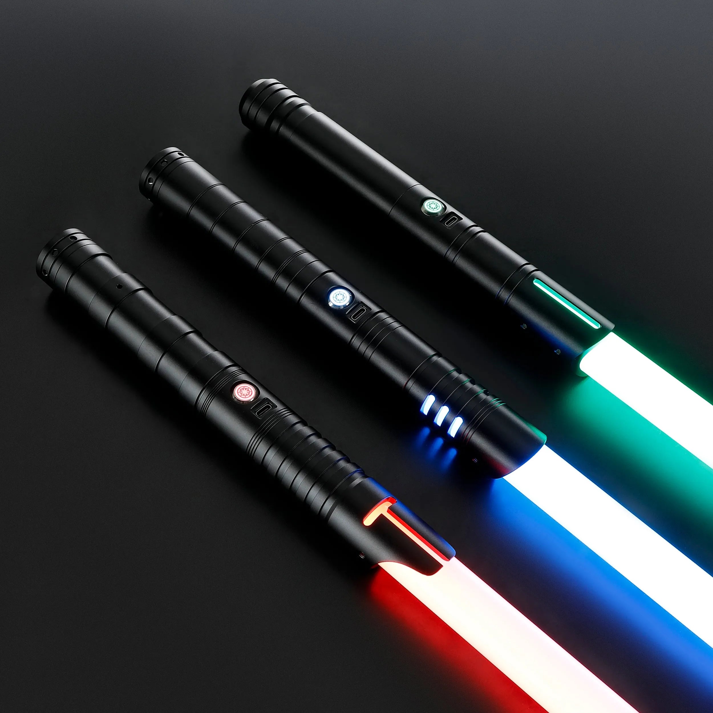 Three black T6 aluminum alloy dueling sabers with glowing red, blue, and green blades.