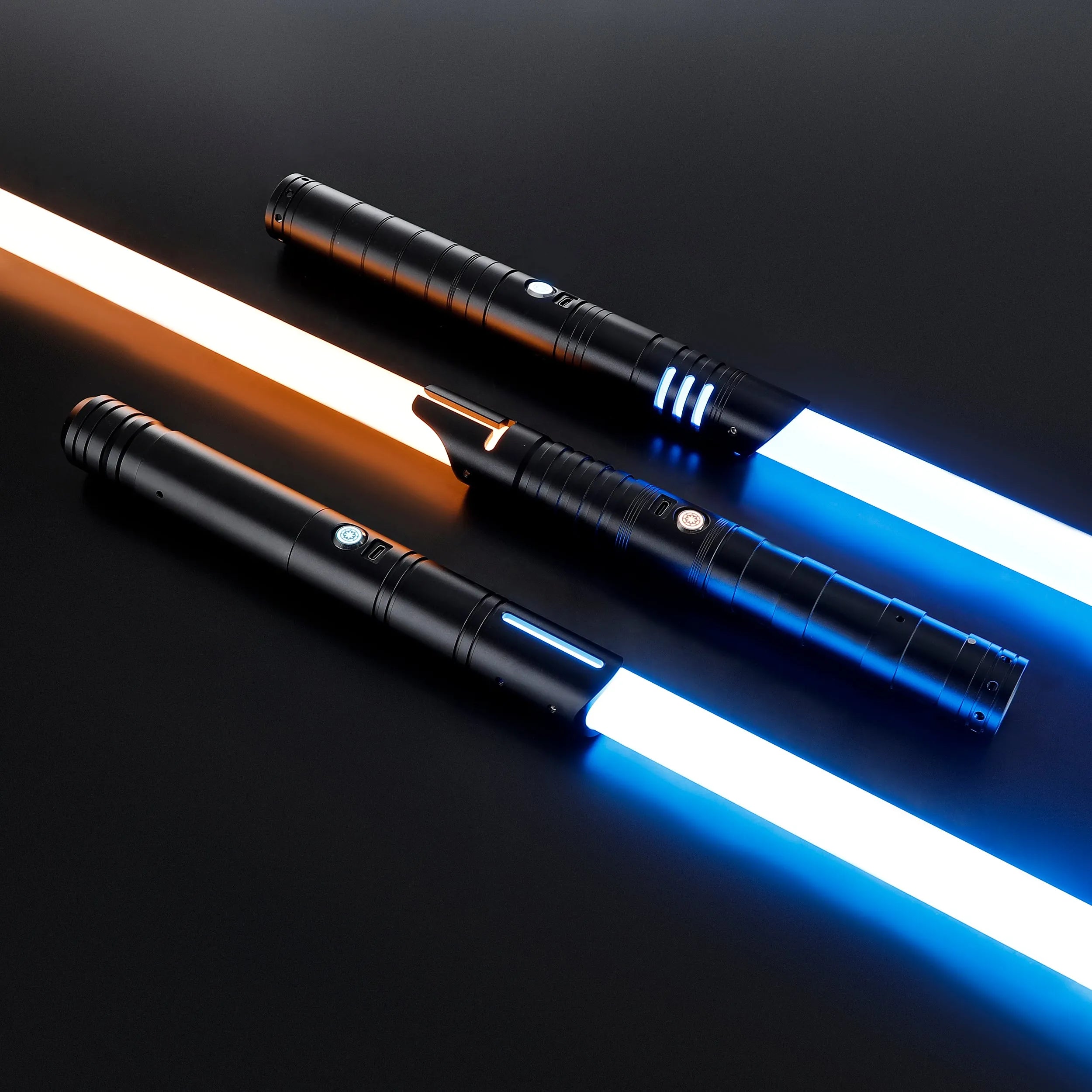 Three black T6 aluminum alloy dueling sabers with glowing white, blue, and orange blades.