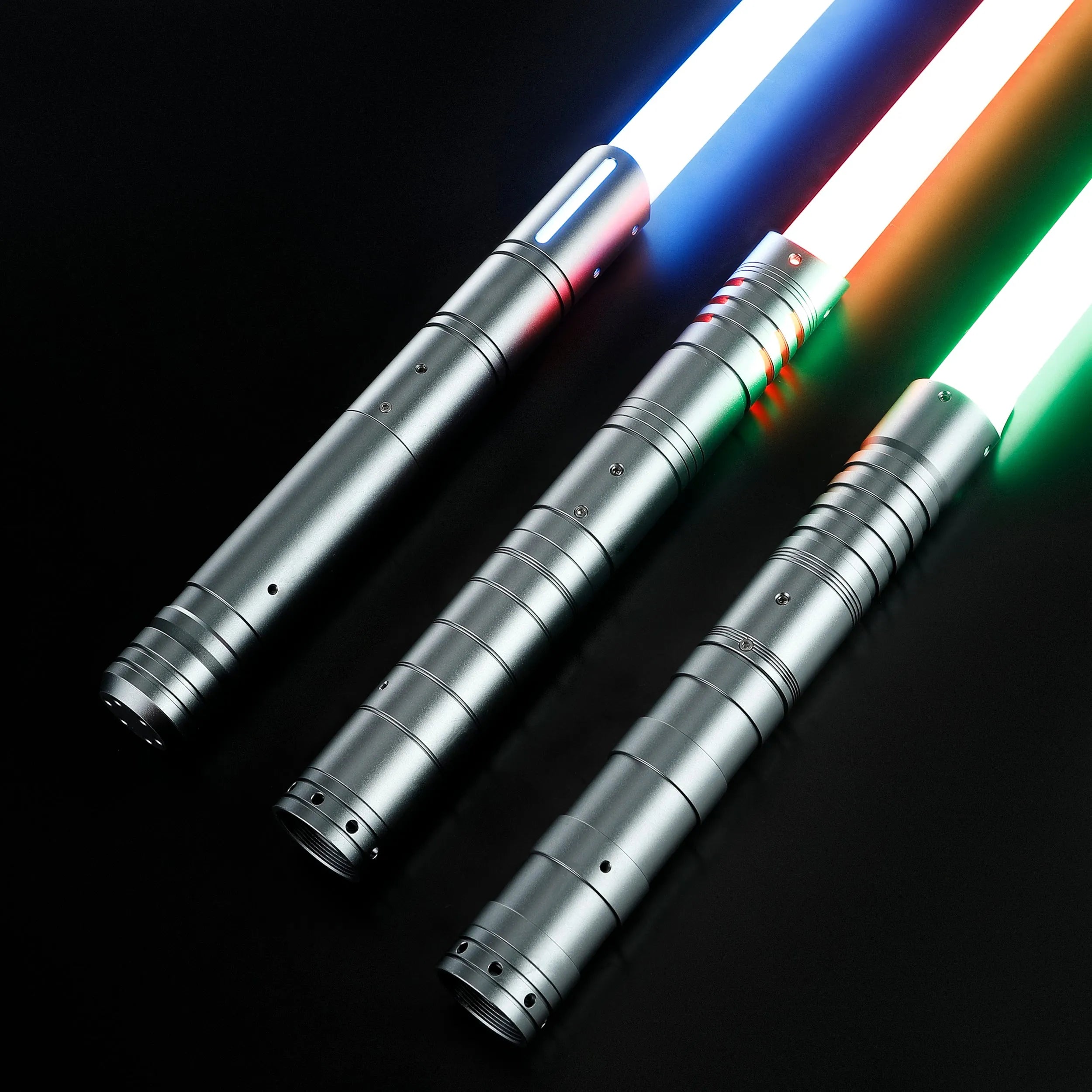 Three silver T6 aluminum alloy dueling sabers with glowing red, blue, and green baselit blades.
