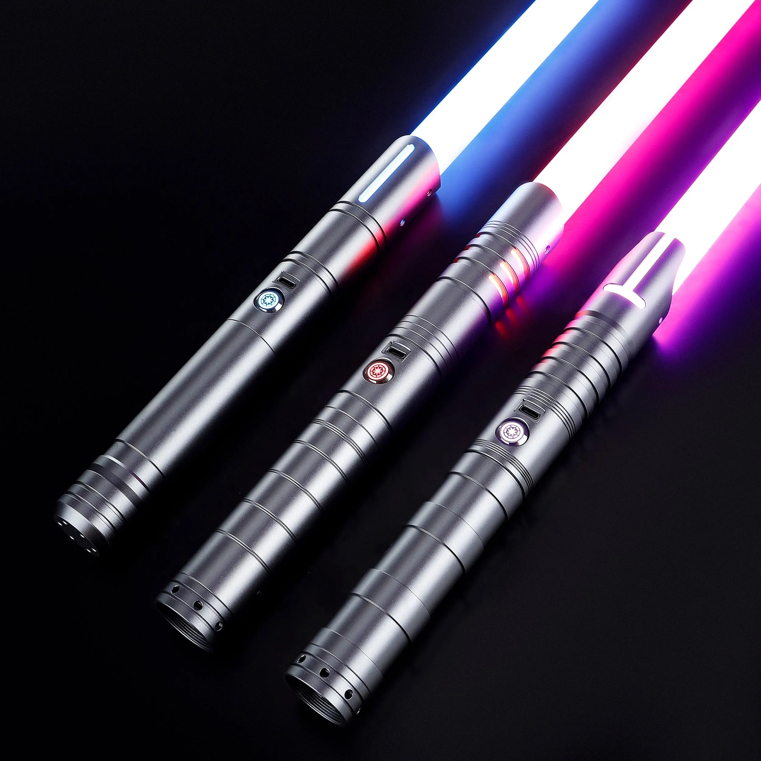 Three gray T6 aluminum alloy dueling sabers with glowing white, blue, and purple blades.