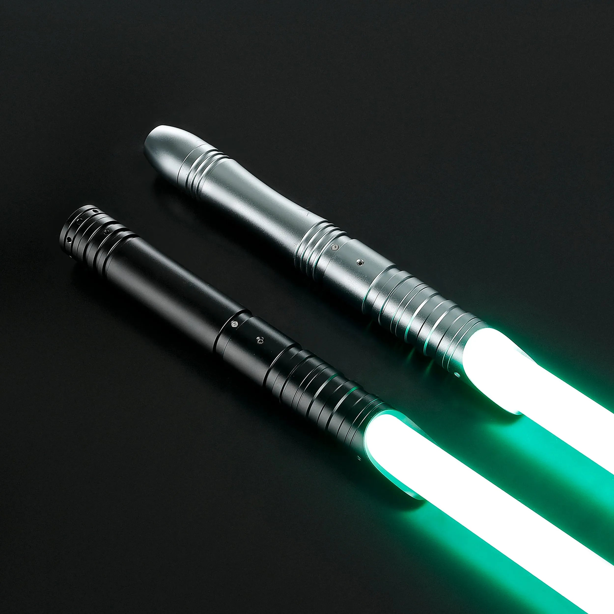 Two aluminum alloy sabers, one silver and one black, with glowing green baselit blades.