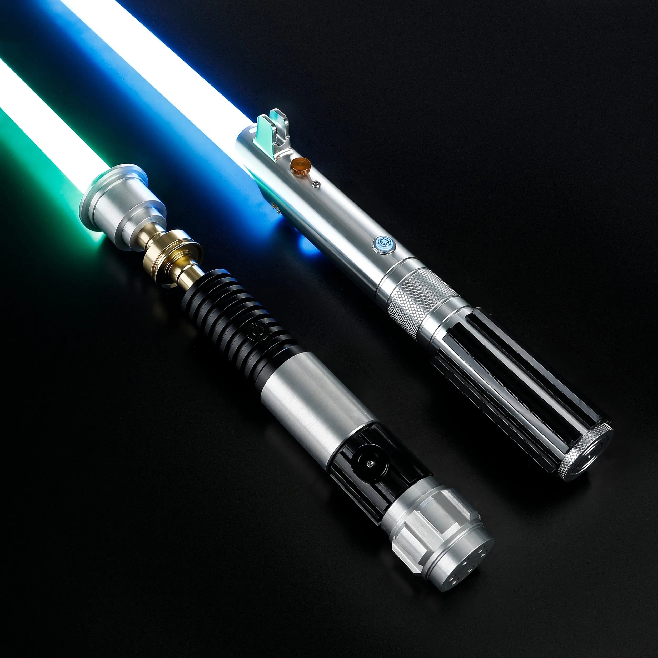 Obi-Wan and Anakin aluminum hilt lightsabers with glowing green and blue polycarbonate blades on a black background.