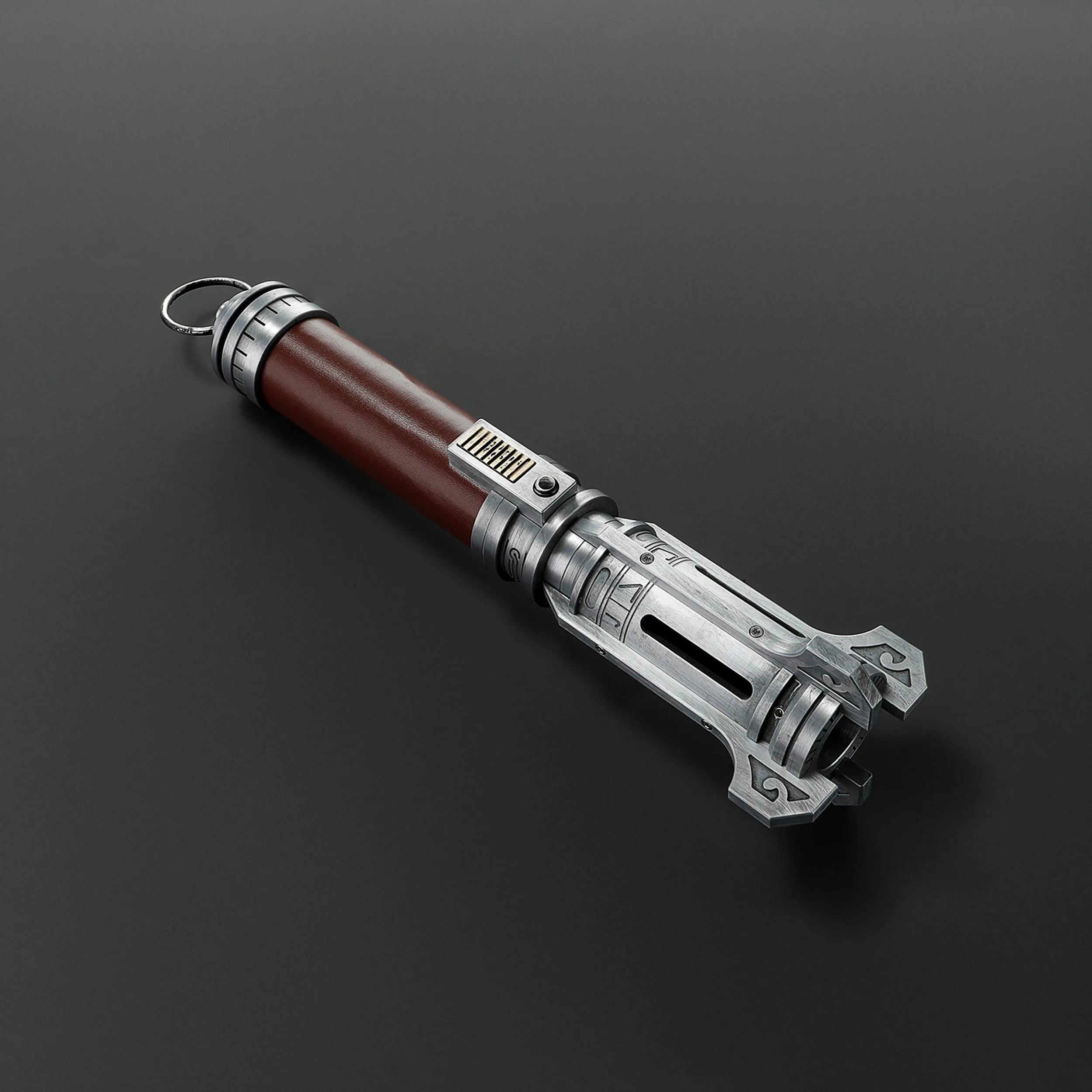 Pilgrim Ascendant Path Saber with a rich brown grip and intricately machined silver emitter.
