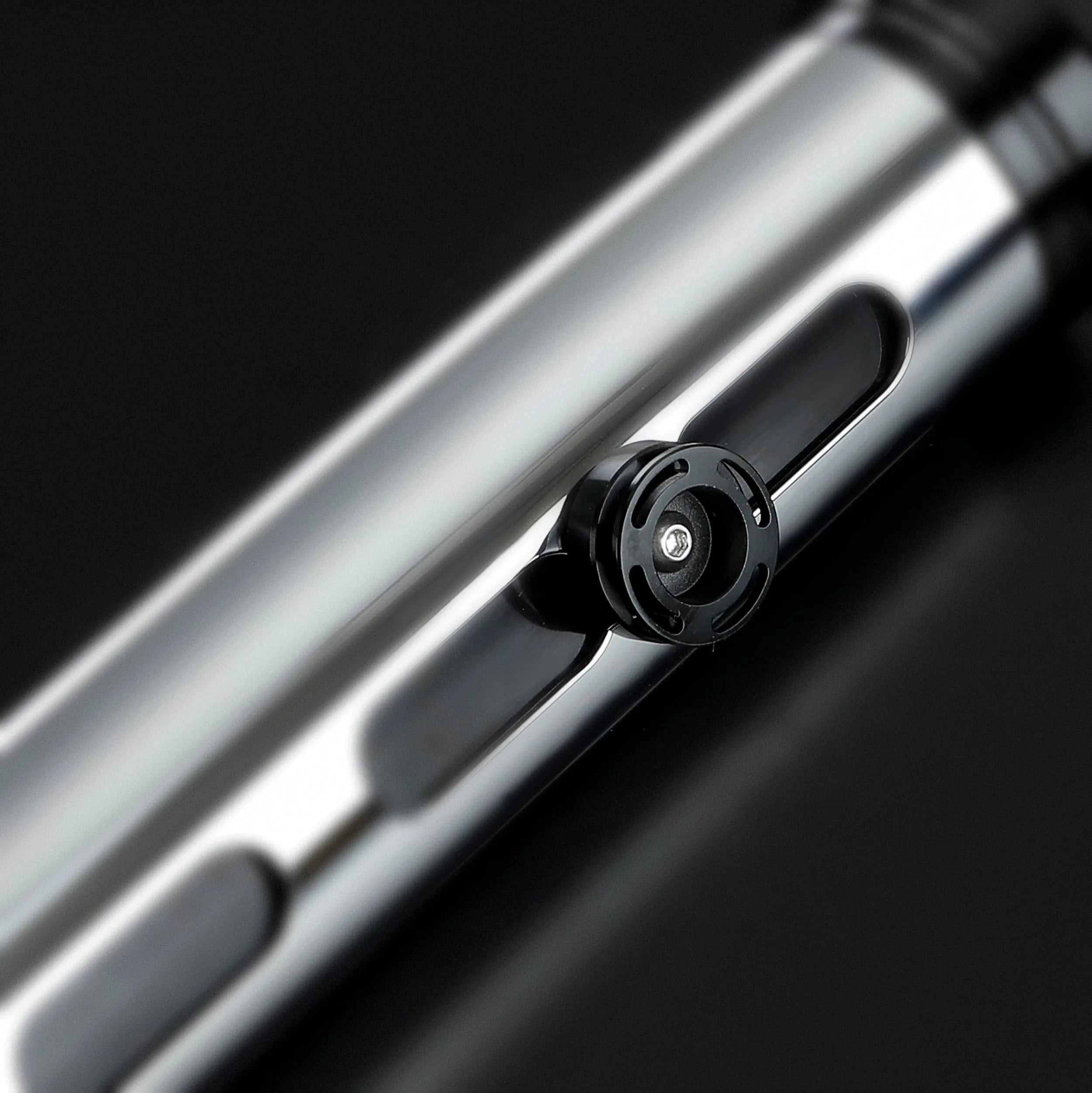 Qui-Gon Jinn lightsaber hilt, shiny silver T60 aluminum with black activation switch and accents.