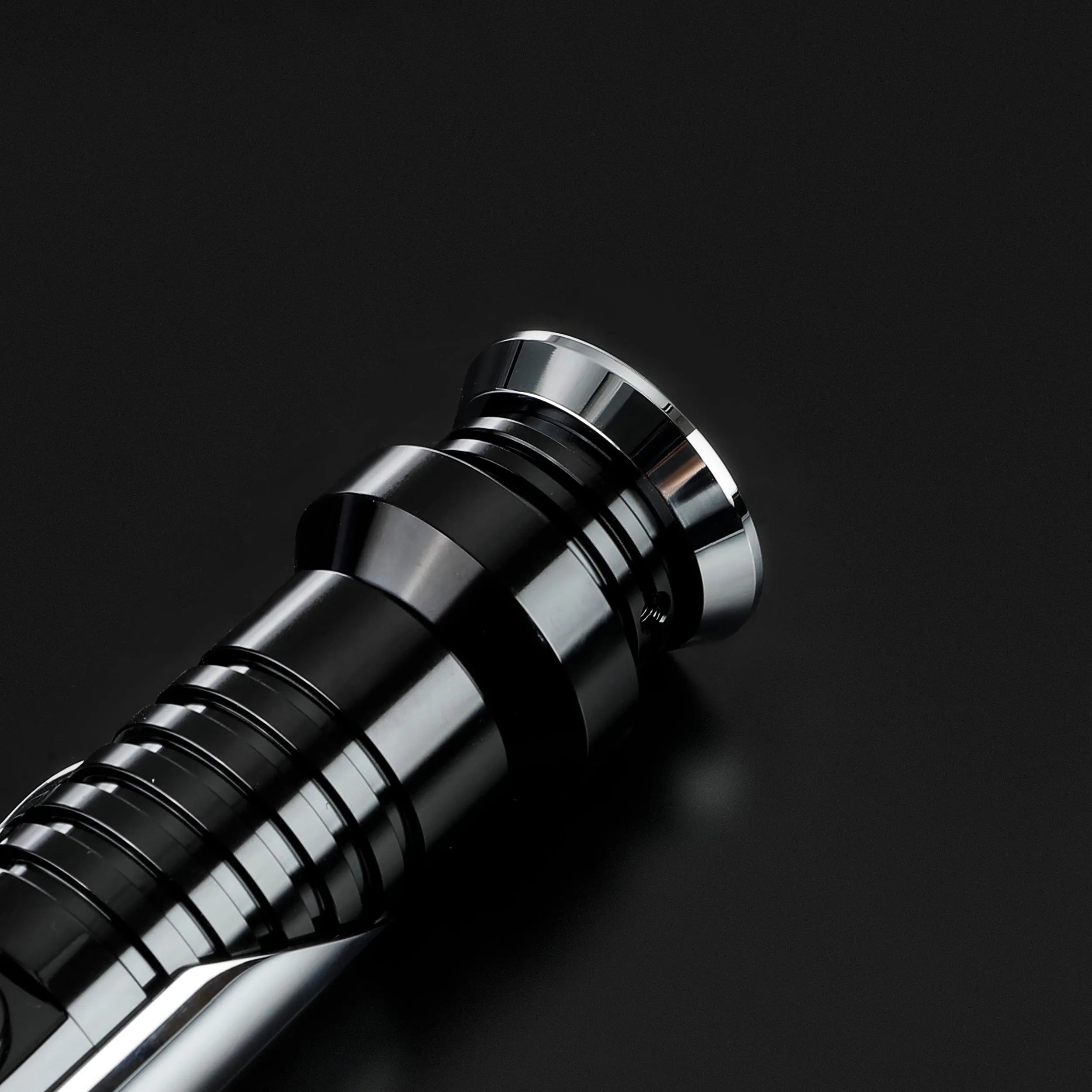 Qui-Gon Jinn lightsaber hilt, black and silver T60 aluminum, sleek design.