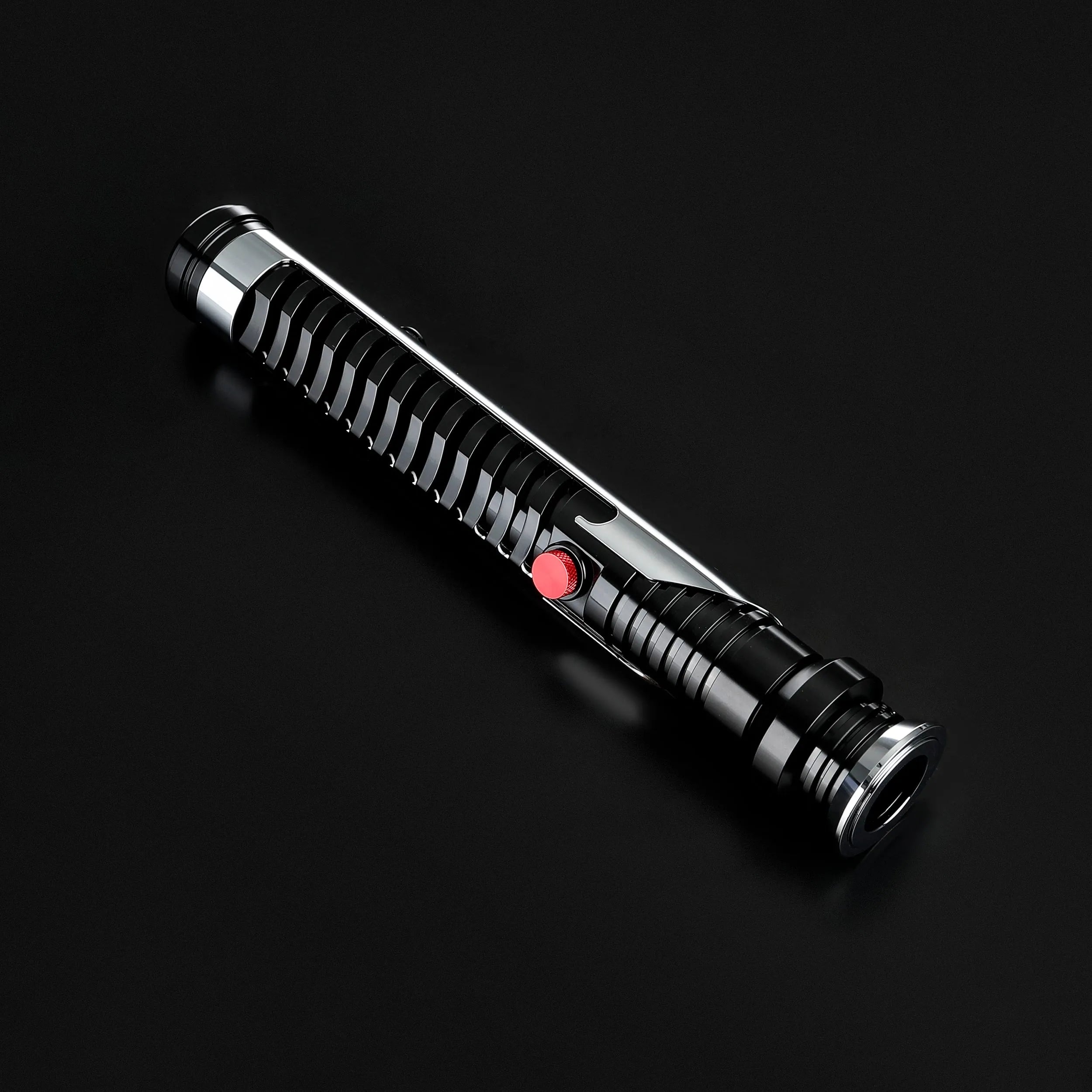 Qui-Gon Jinn lightsaber with a black ribbed grip, silver accents, and a red activation button.