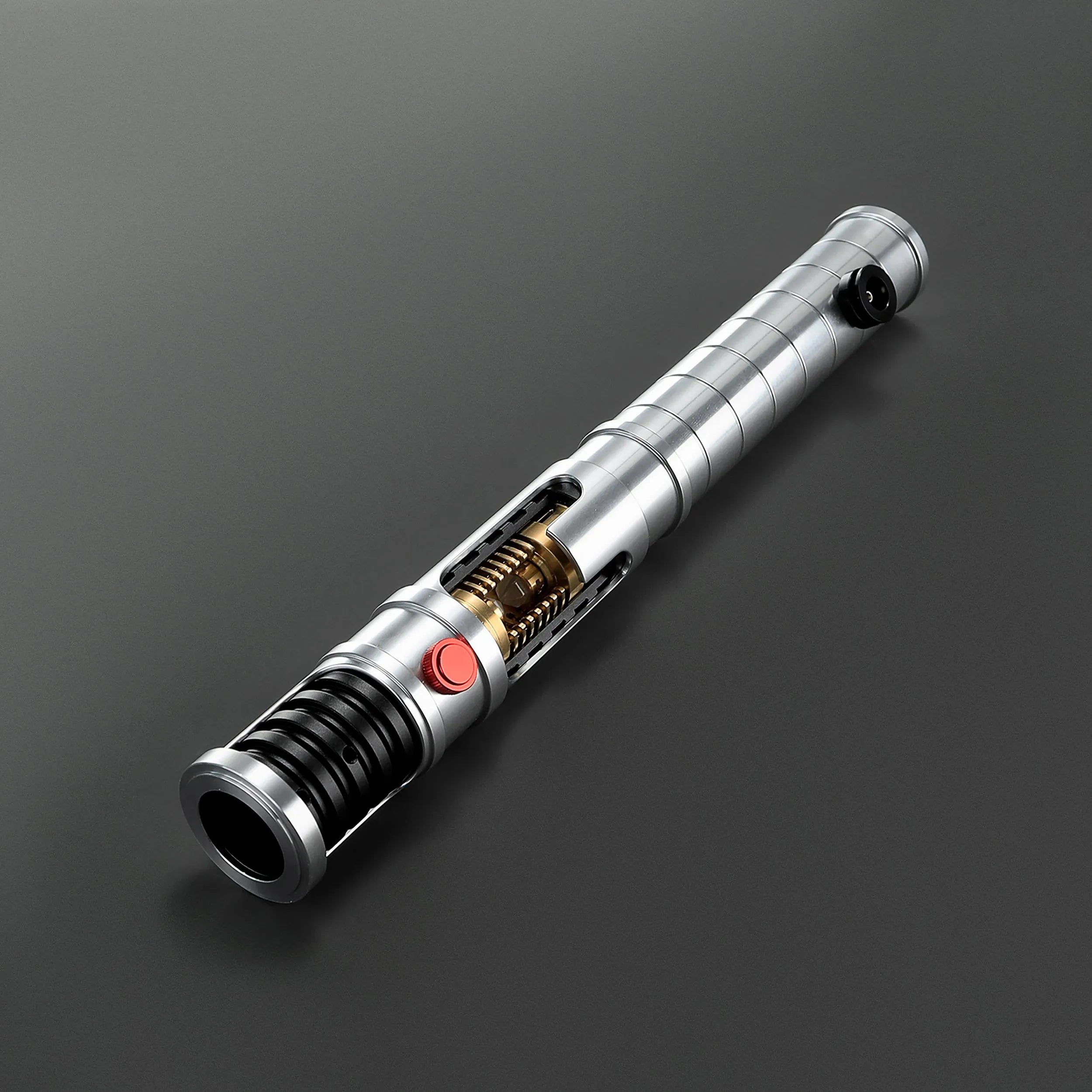 Brushed aluminum Quinlan Vos lightsaber hilt with exposed kyber crystal chamber, red activation button, and black accents.