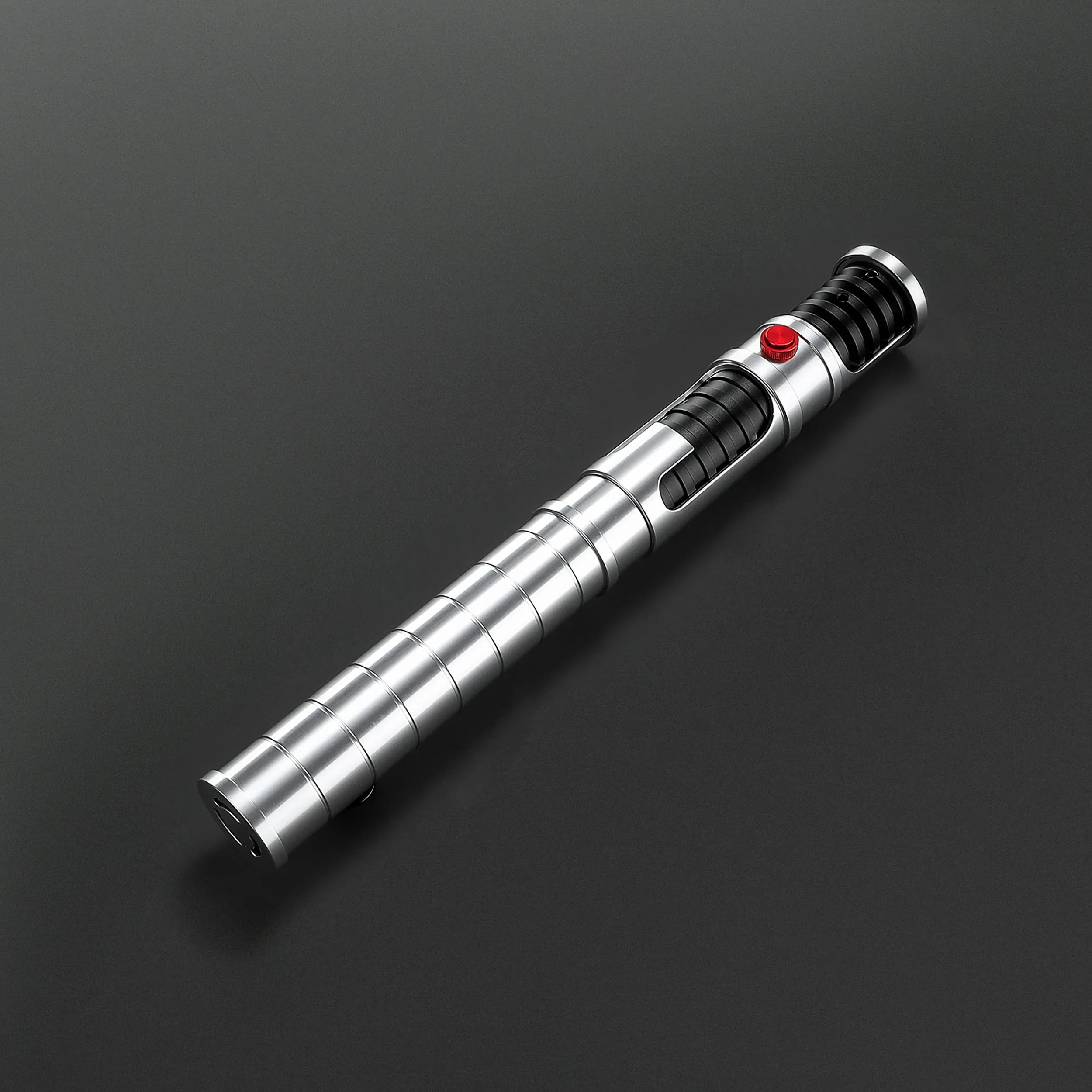 Quinlan Vos Saber: Brushed aluminum hilt with a red button, black grip, and exposed kyber crystal chamber.
