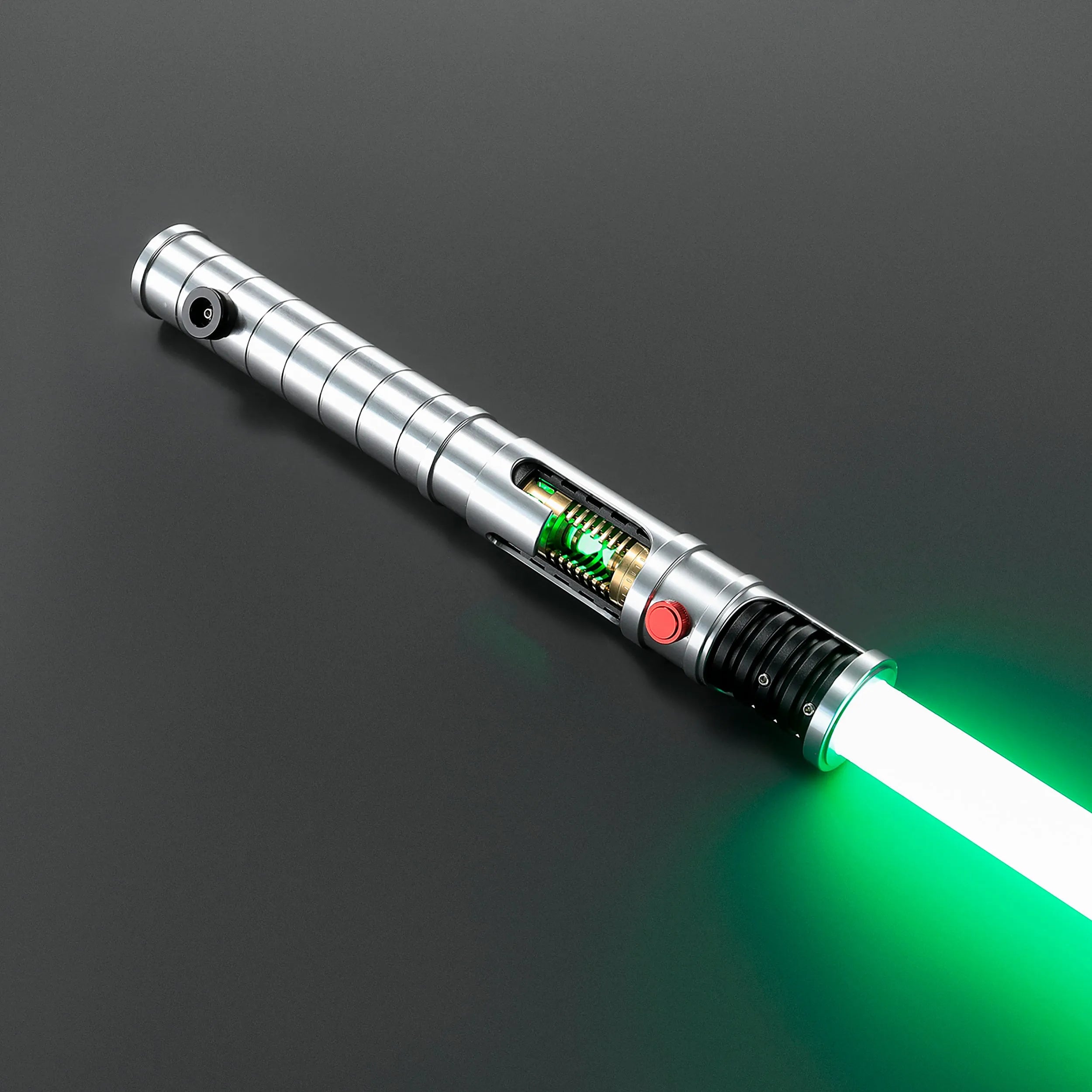 Quinlan Vos saber with brushed aluminum hilt, visible green kyber crystal chamber, and glowing green blade.