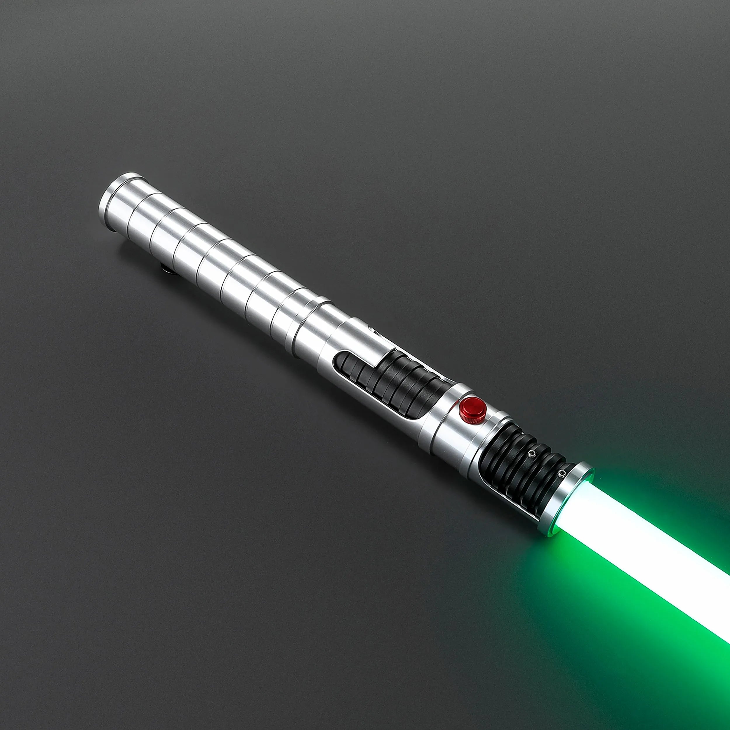 Quinlan Vos Saber: Brushed aluminum hilt with a visible kyber chamber, black grip, red button, and green blade.