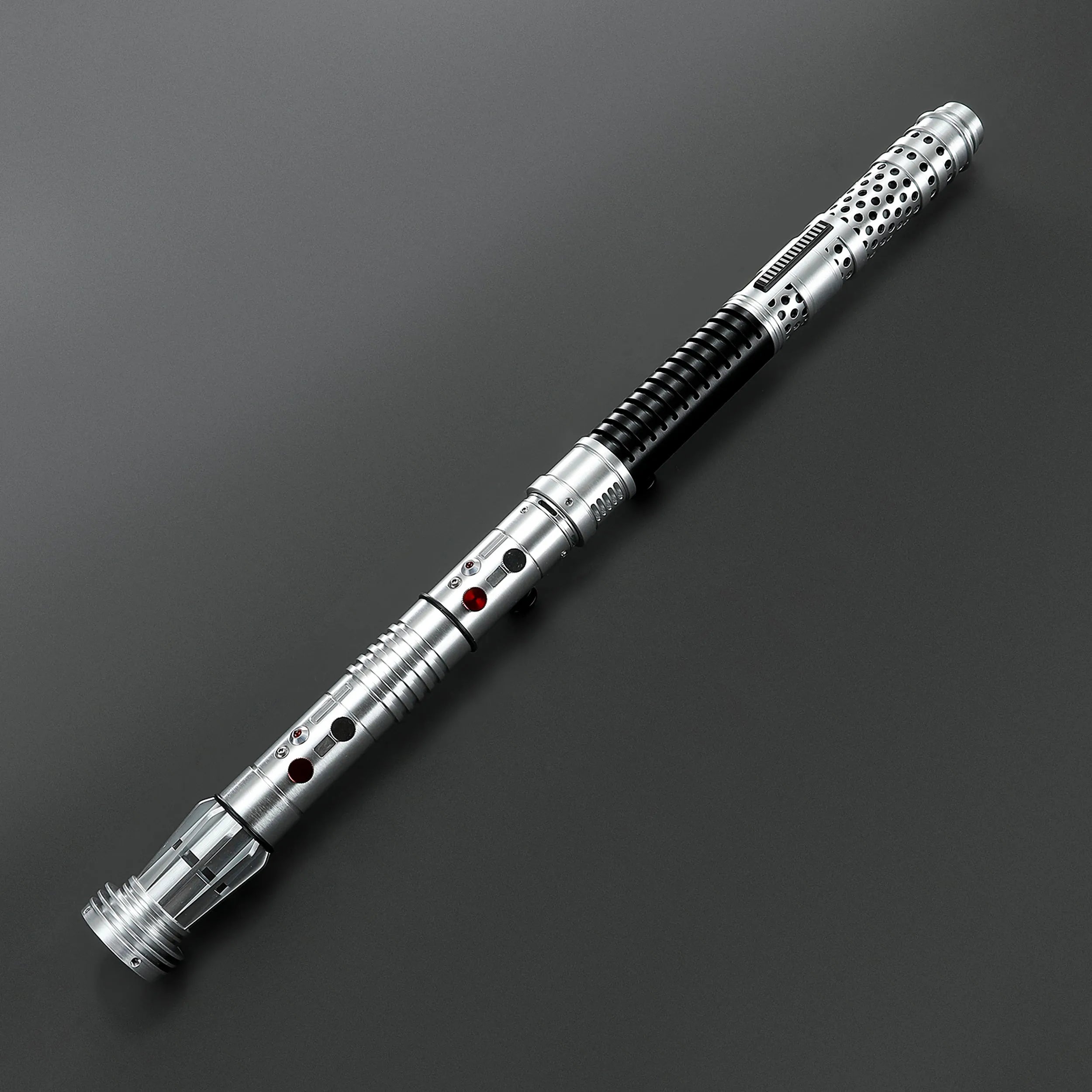Brushed silver metal Shadow Lord saber hilt with black grip and red buttons, designed for dual-blade combat.