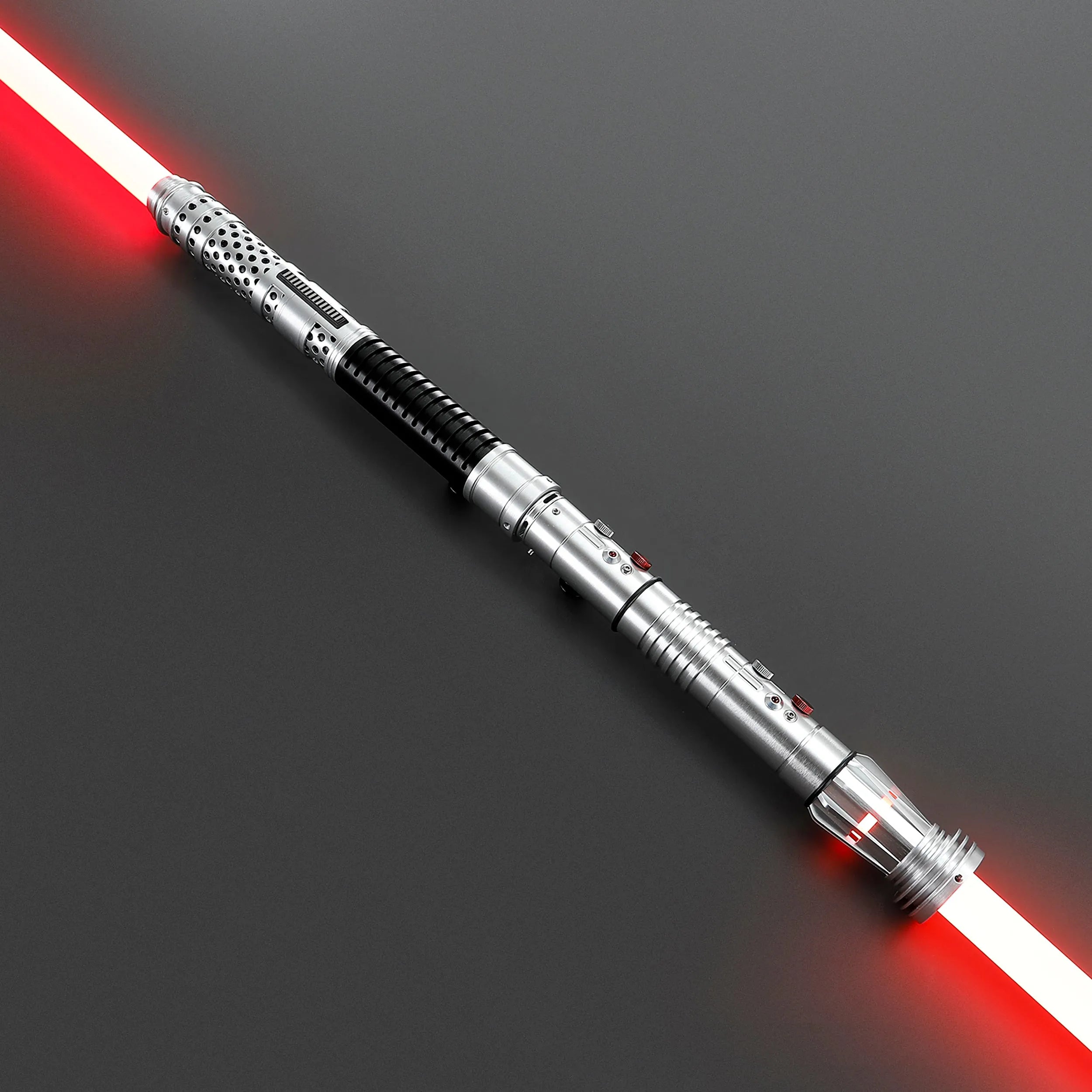 Brushed silver metal Shadow Lord saber staff with two glowing red polycarbonate blades, black grips, and industrial Sith design.
