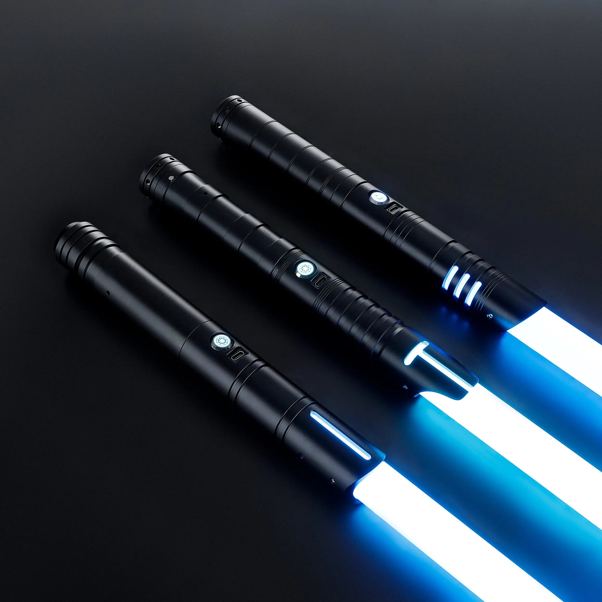 Three black T6 aluminum alloy sabers with glowing blue blades, ready for dueling.