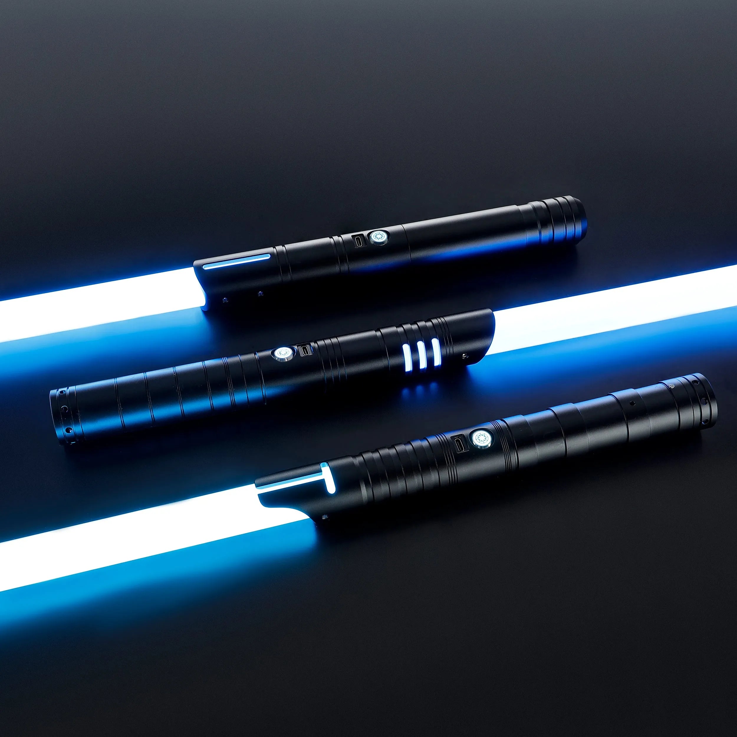 Three black T6 aluminum alloy dueling sabers with glowing blue blades, Defender, Hunter, and Enforcer 2.