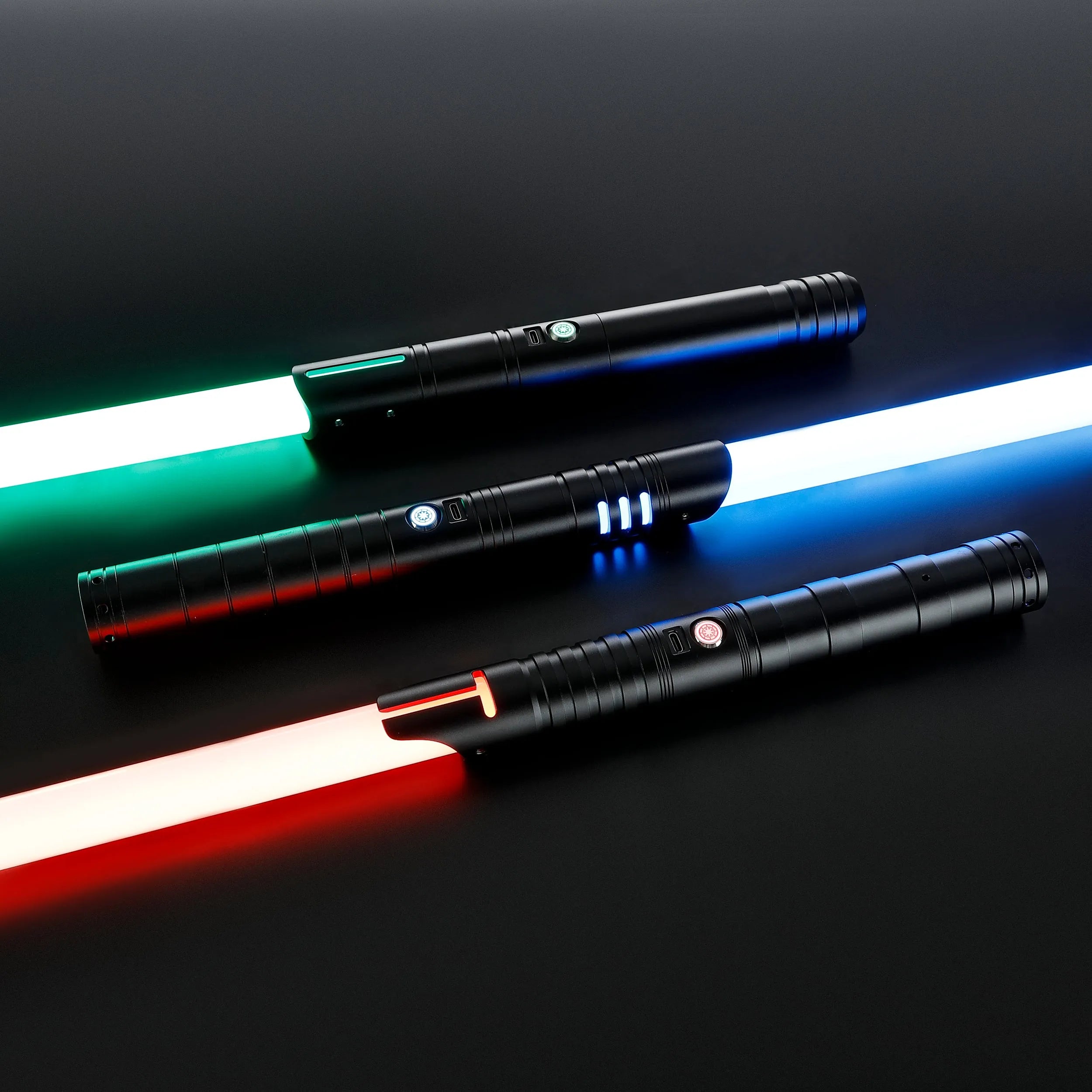 Three black T6 Aluminum Alloy dueling sabers with glowing green, blue, and red blades.