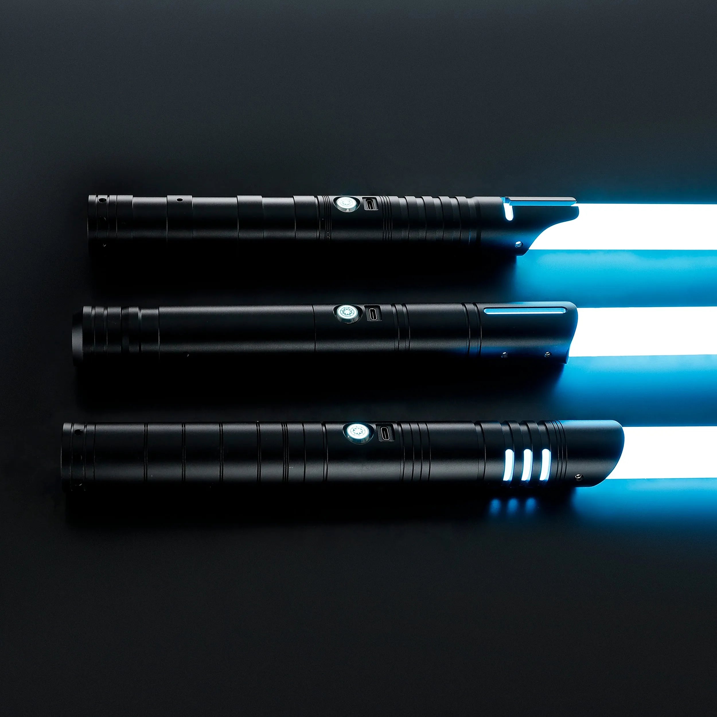 Three black T6 Aluminum Alloy dueling sabers with glowing blue blades, Defender, Hunter, and Enforcer 2.