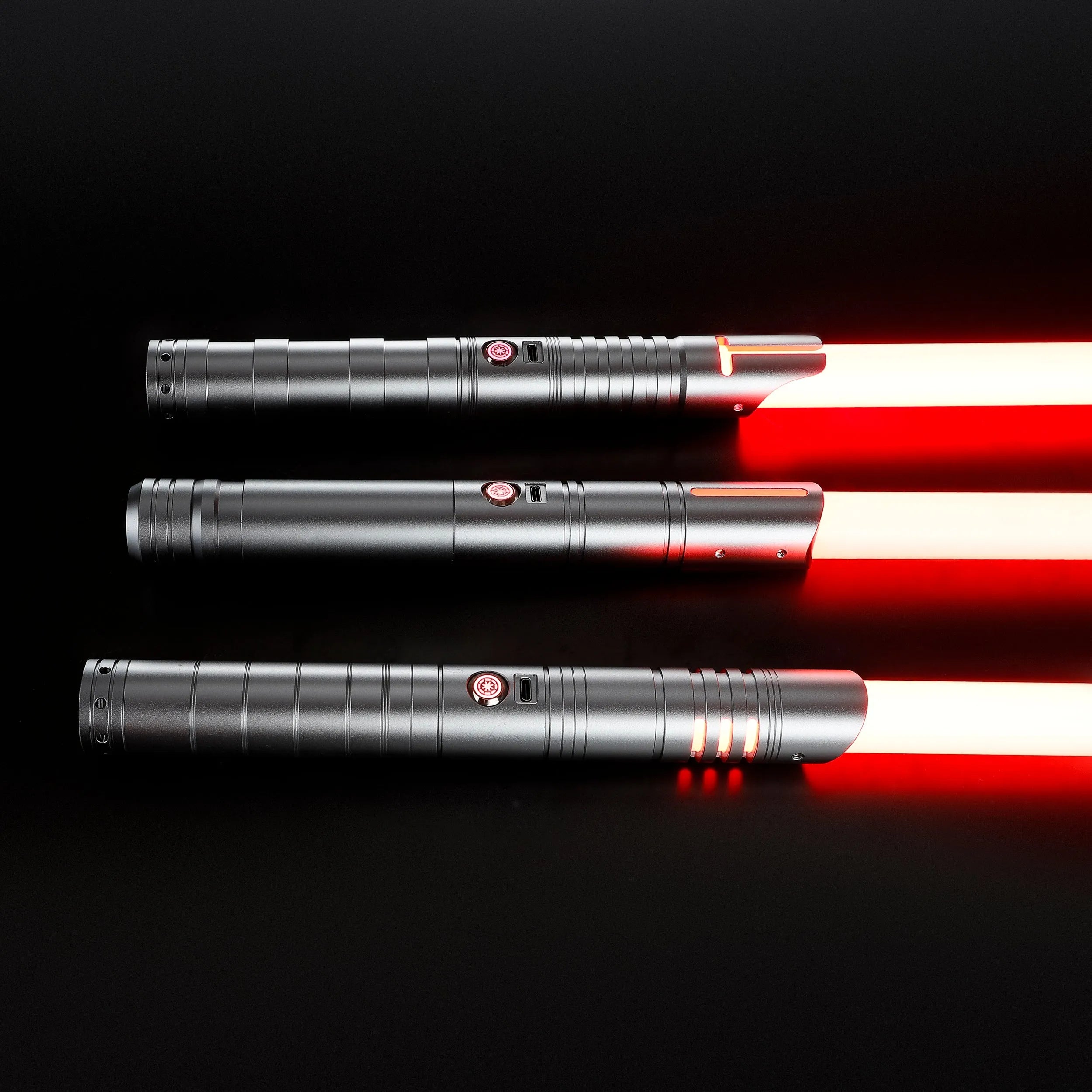 Three silver T6 aluminum alloy dueling sabers with glowing red baselit blades on a black background.