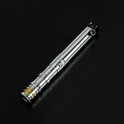 Heavy dueling Darth Revan lightsaber replica with a chrome silver hilt, black accents, and a gold pommel.