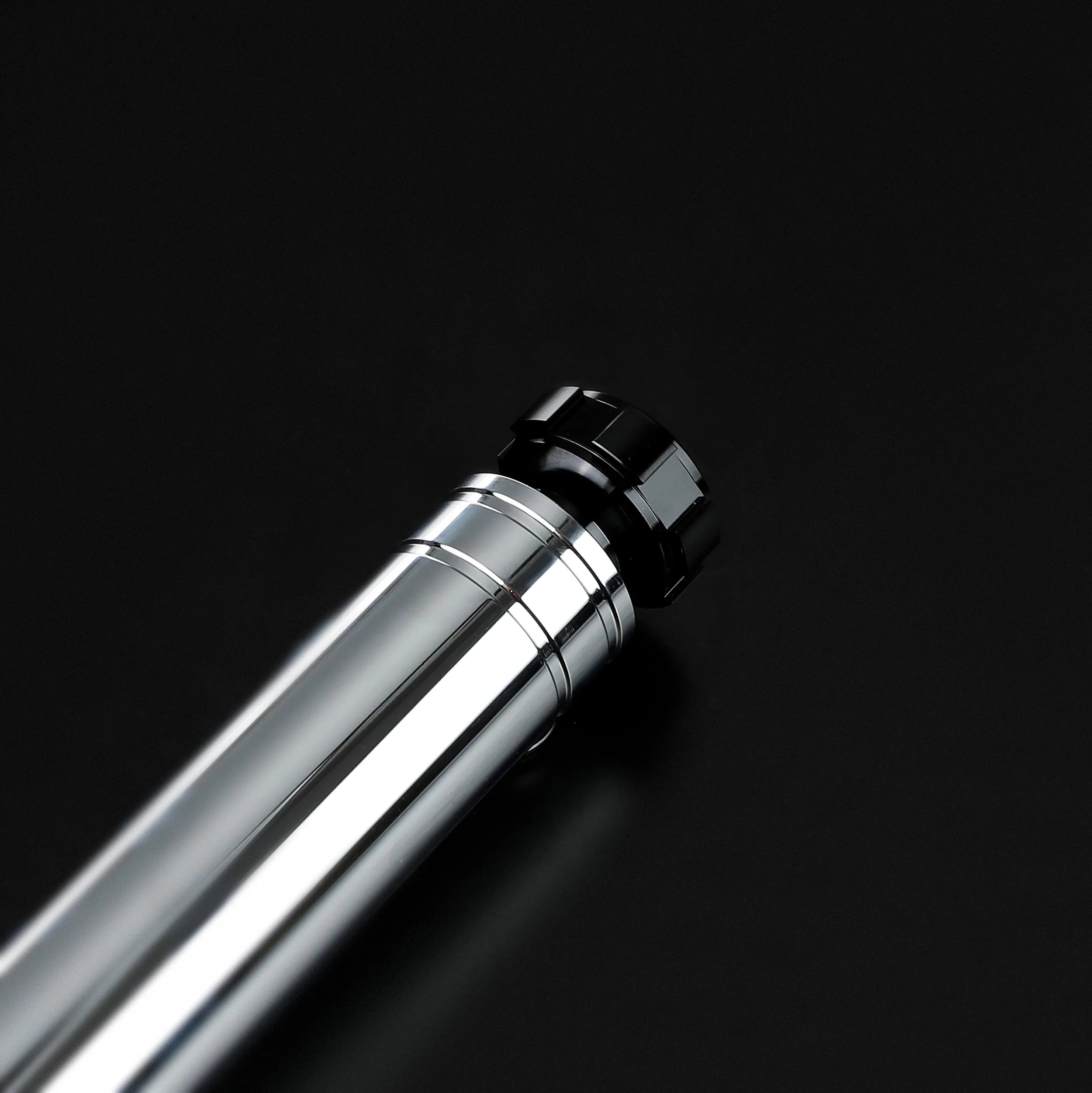 Sleek, chrome-plated Darth Revan lightsaber hilt with black accents, designed for heavy dueling.