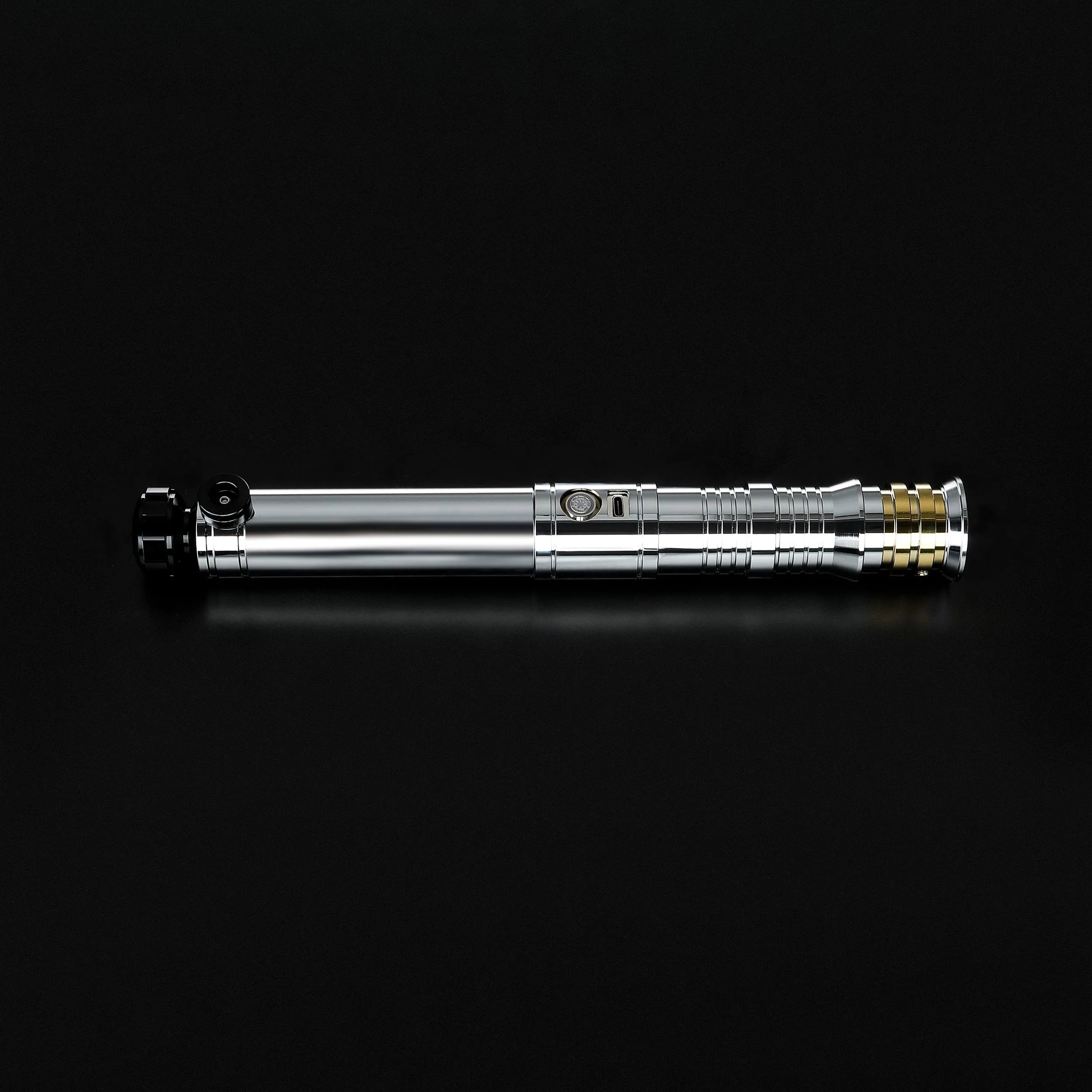 Heavy dueling Darth Revan lightsaber replica with a silver hilt, gold accents, and black grip details.