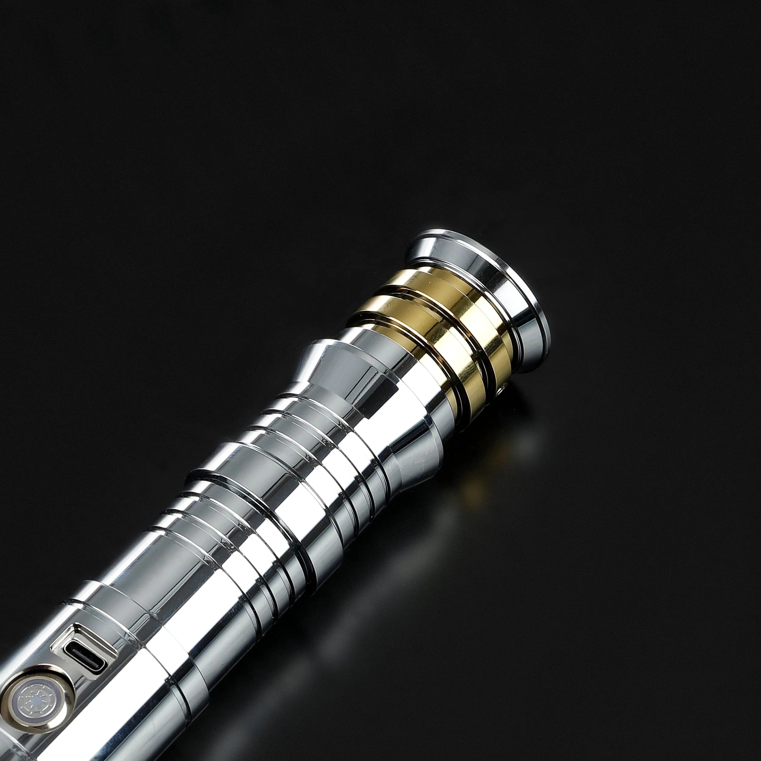 Heavy dueling Darth Revan lightsaber replica with a silver hilt, gold accents, and a detailed grip.