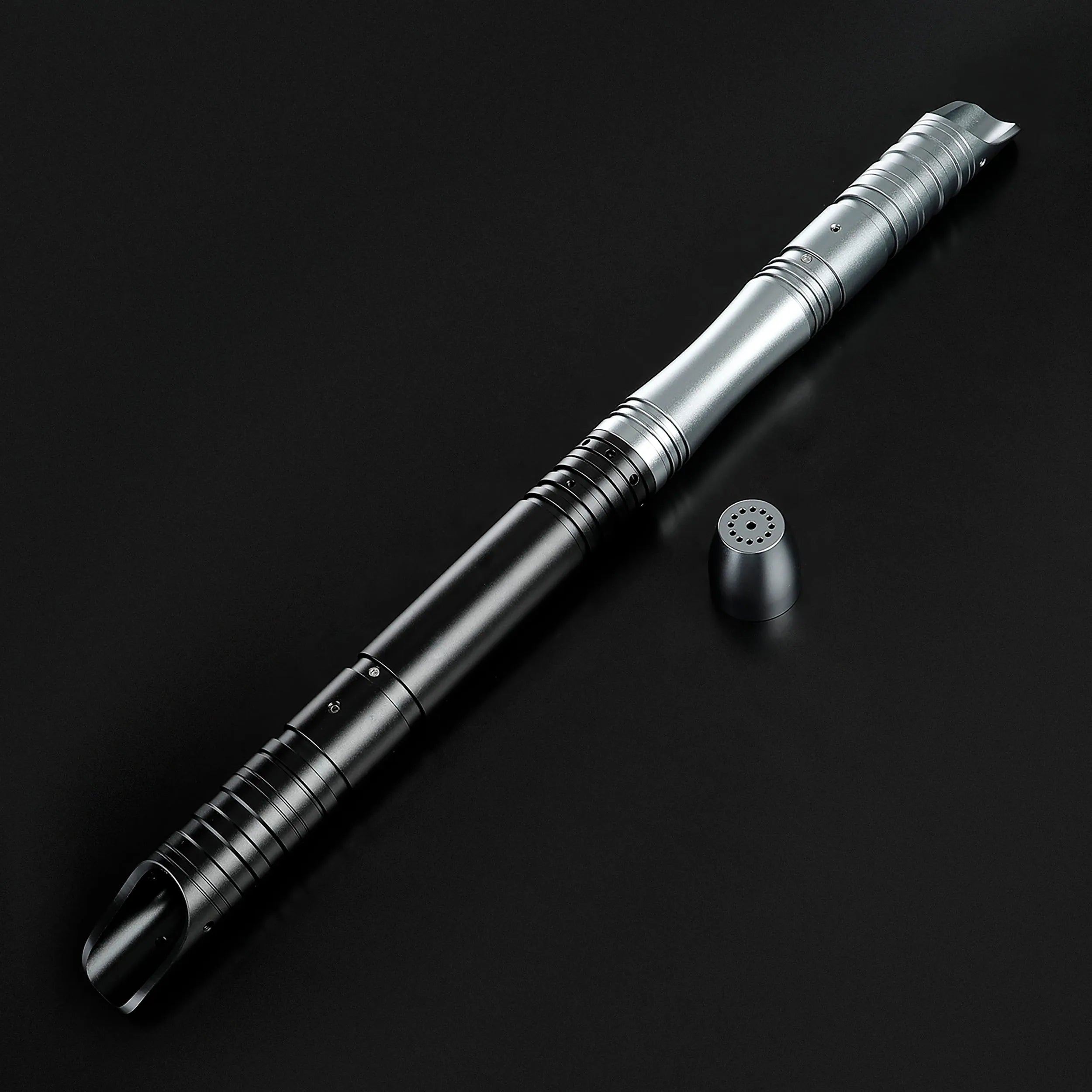 Sleek black and silver T6 aluminum alloy saber hilt with a speaker cap, ready for dueling.