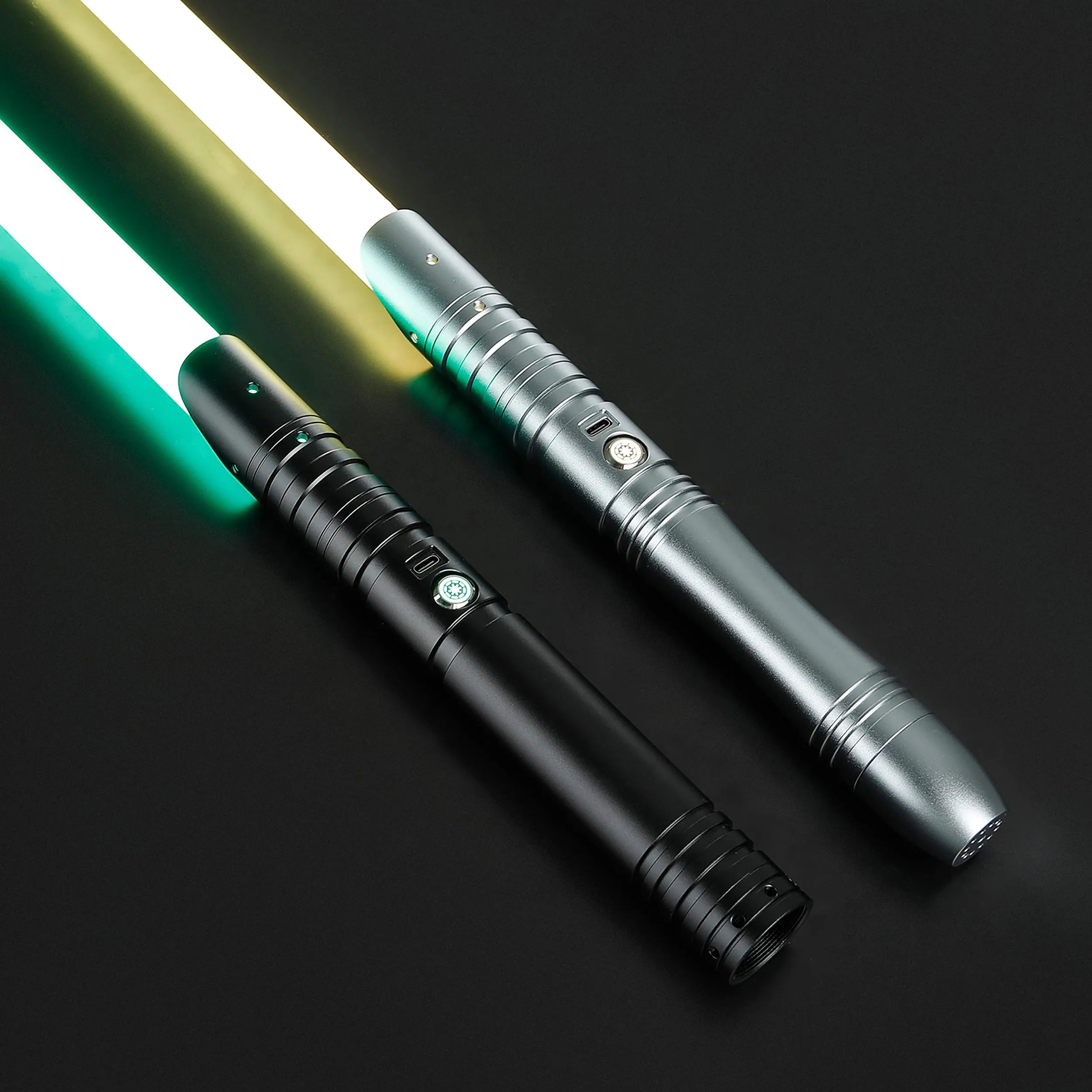Two aluminum alloy sabers: one black with a green blade, one silver with a yellow blade.