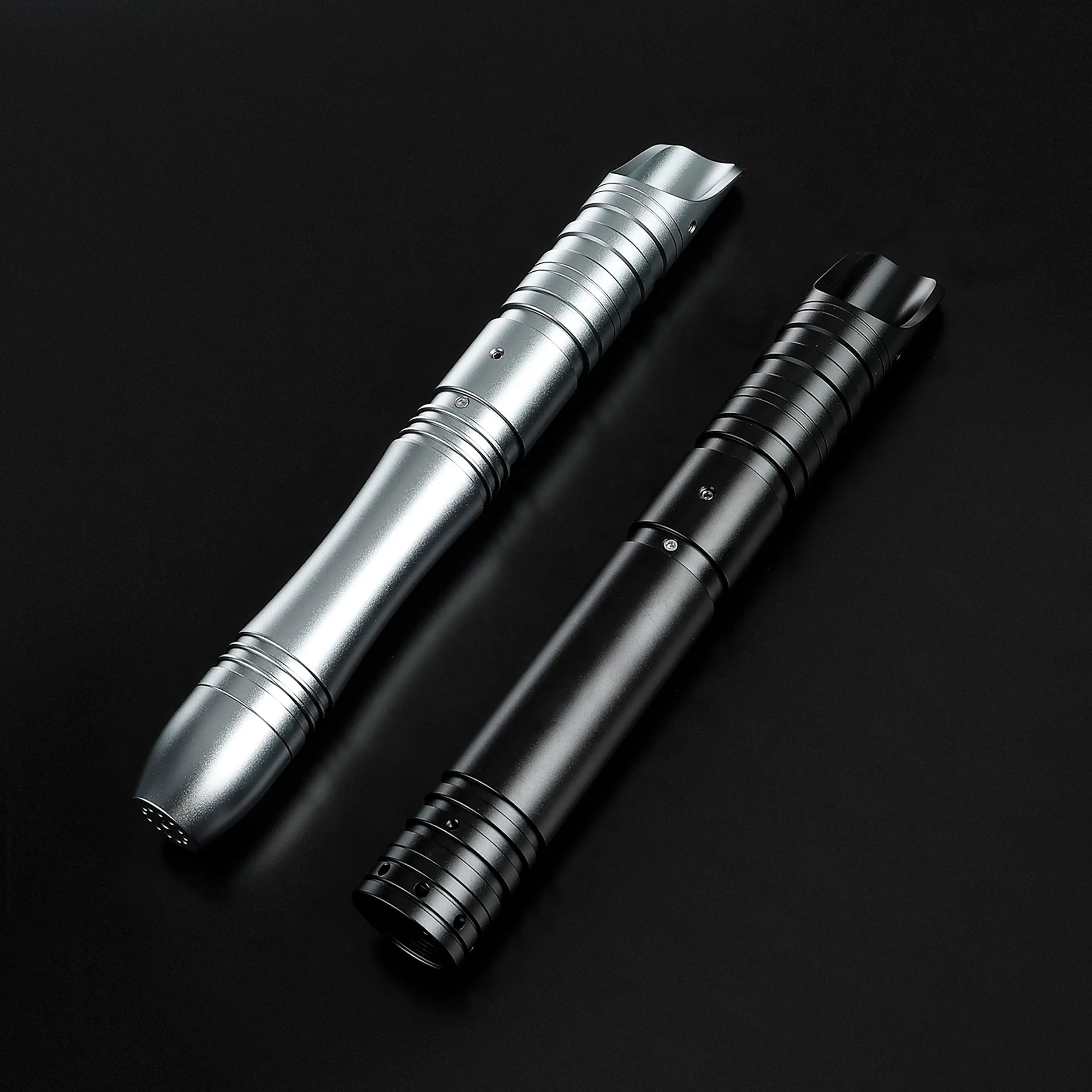 Two aluminum alloy saber hilts, one silver and one black, for father and son dueling.