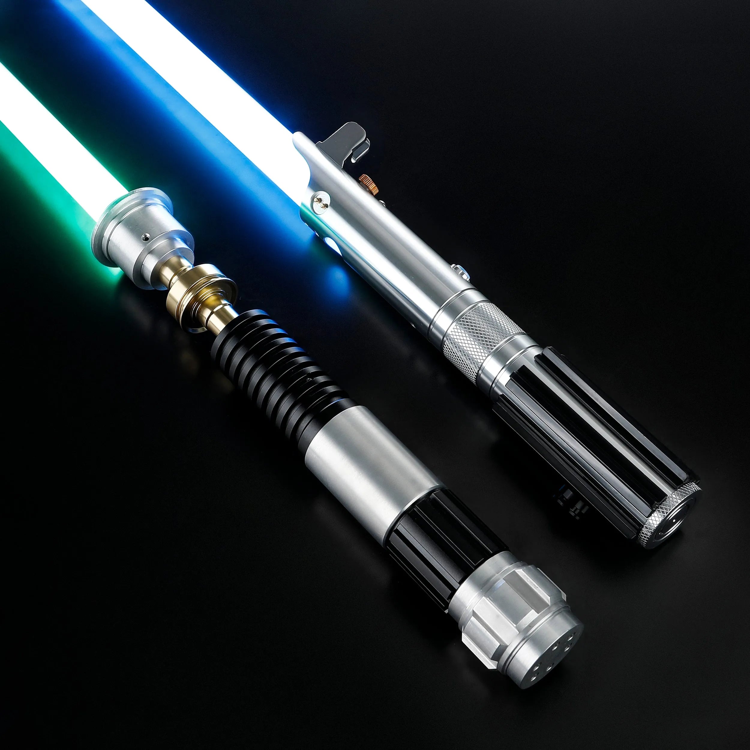 Obi-Wan and Anakin aluminum alloy lightsabers with glowing blue and green polycarbonate blades on a black background.