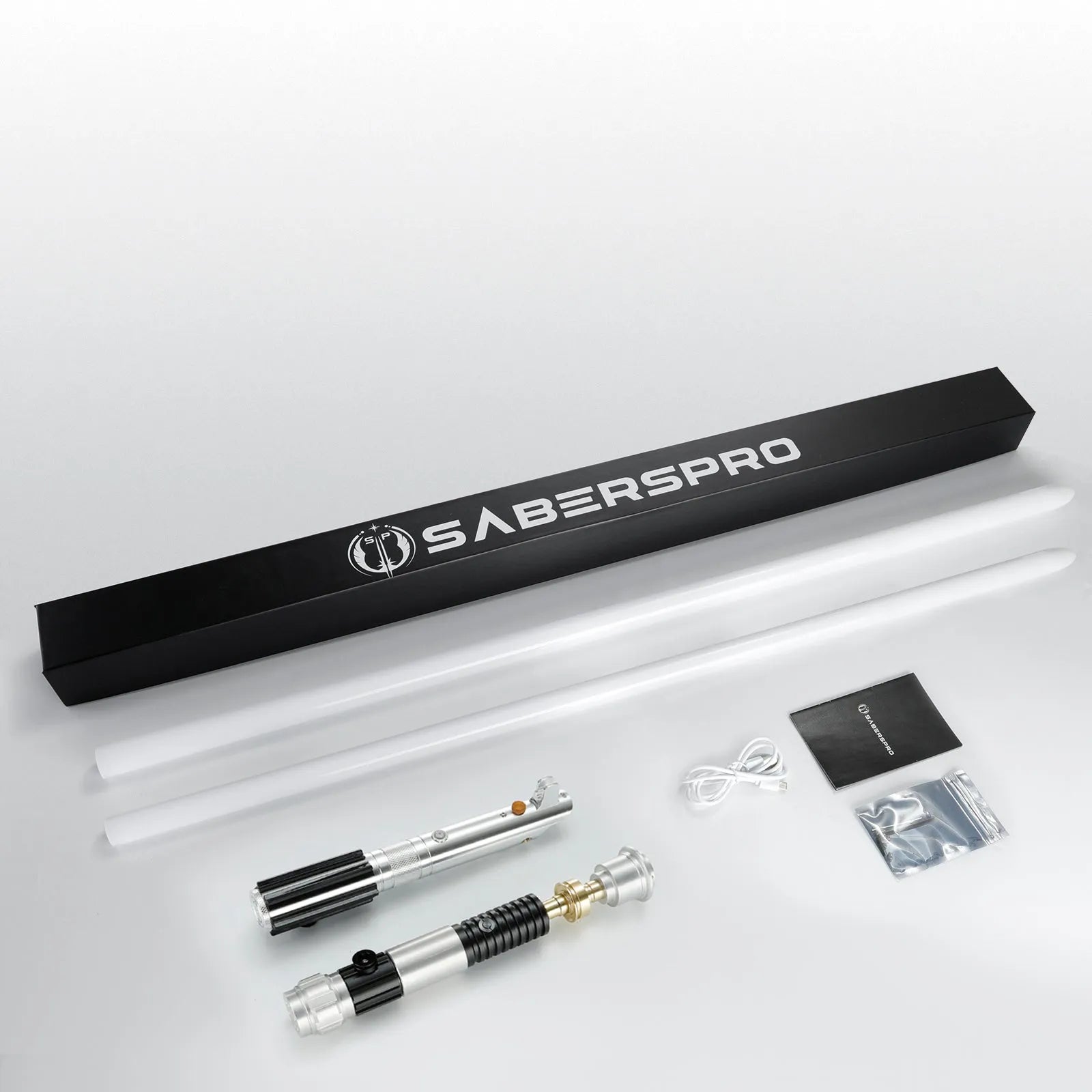 Obi-Ani two-saber bundle featuring aluminum alloy hilts, two polycarbonate blades, charging cable, and SabersPro box.