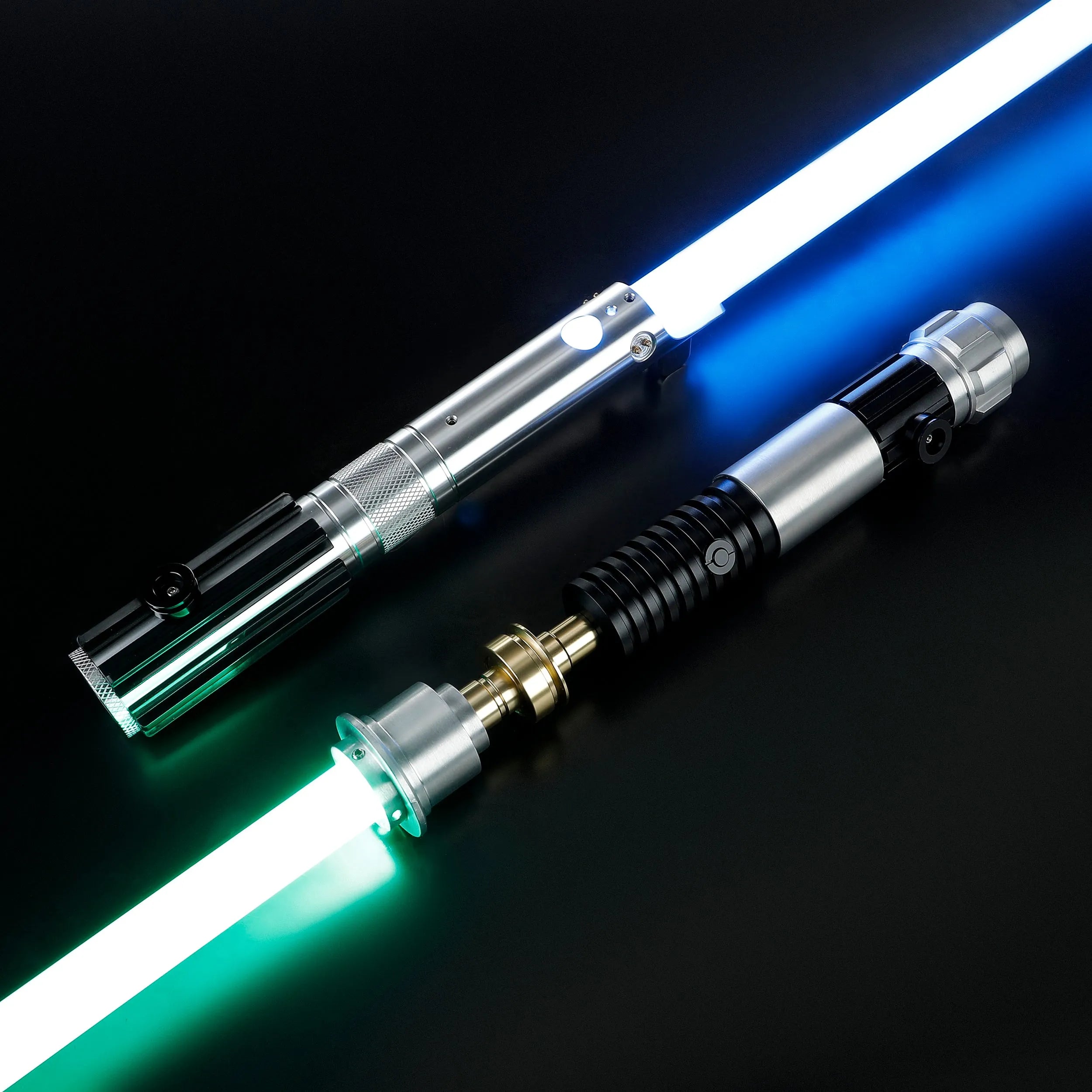 Obi-Wan and Anakin aluminum alloy lightsabers with glowing blue and green polycarbonate blades on a black background.