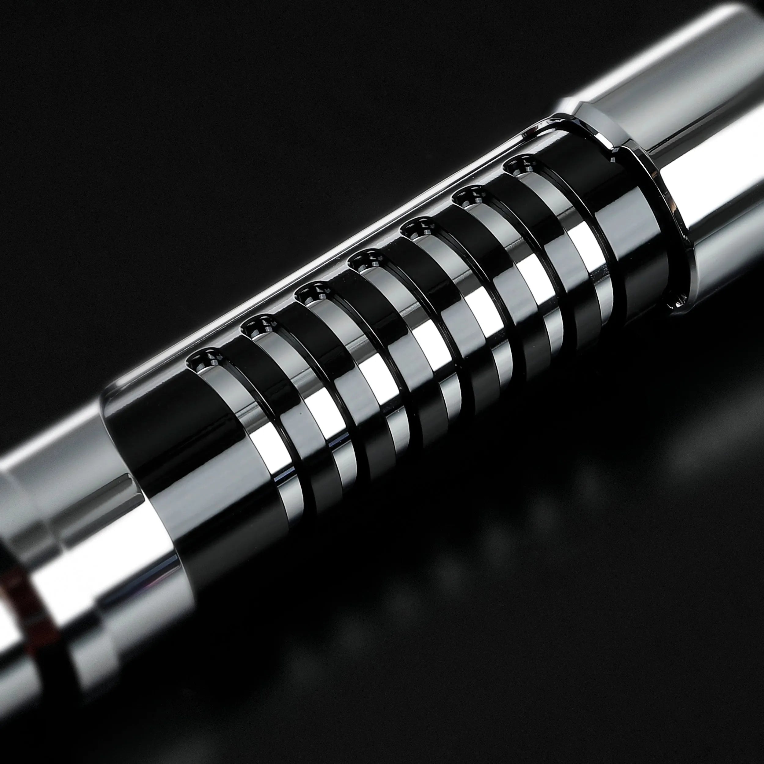 Screen-accurate Obi-Wan EP1 lightsaber hilt, chrome and black with grooved grip, ideal for dueling.