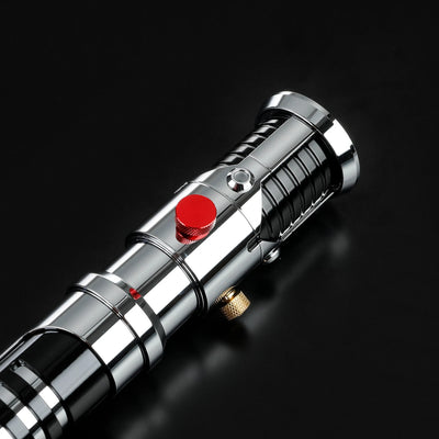 Screen-accurate Obi-Wan EP1 chrome metal lightsaber hilt with grooved grip, red activation button, and gold accents.