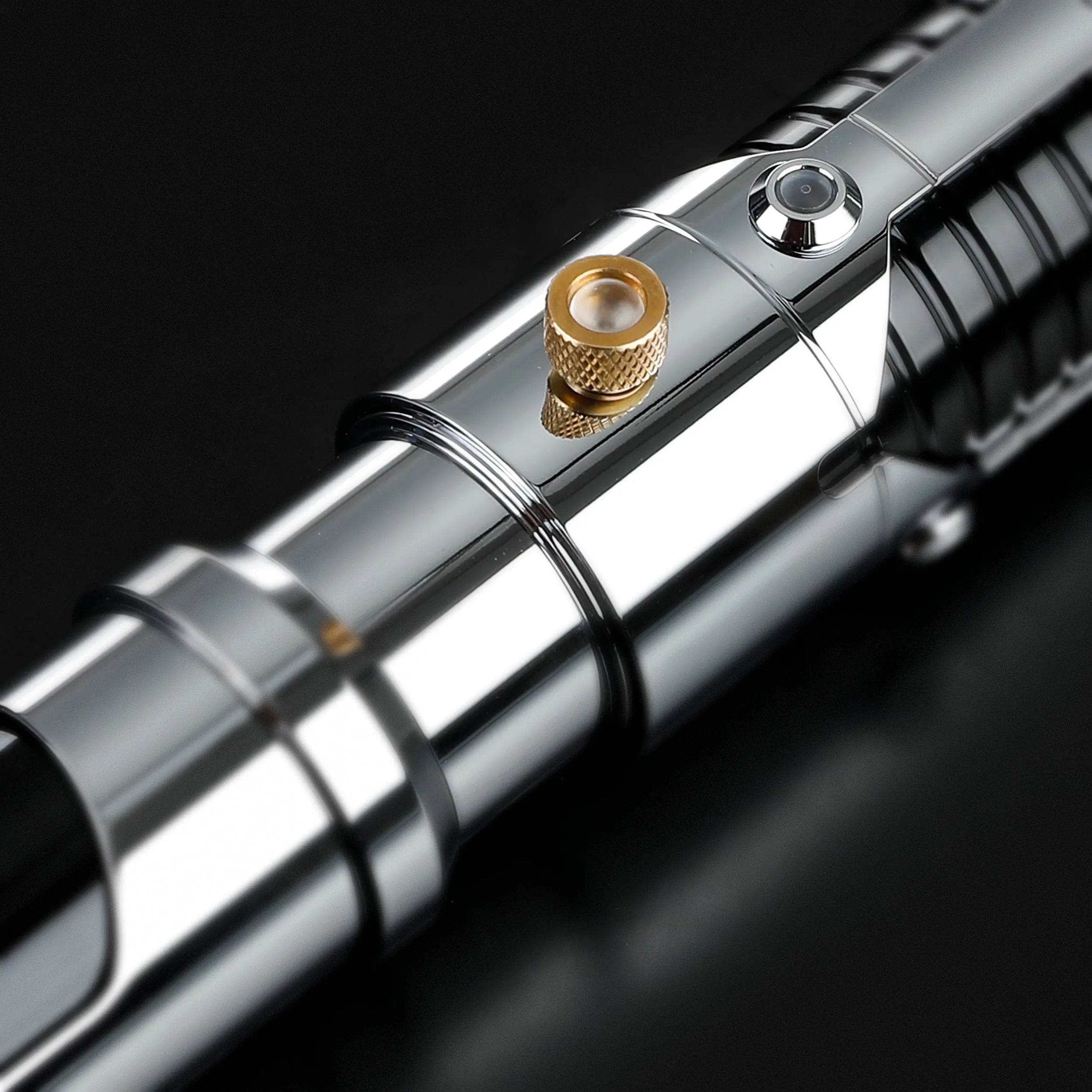 Screen-accurate Obi-Wan EP1 lightsaber hilt, chrome-plated metal with a gold activation switch and grooved grip.