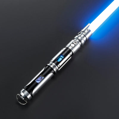 Paragon Xenopixel V3 saber with glowing blue blade, silver and black aircraft-grade aluminum hilt, exposed kyber crystal, and OLED display.