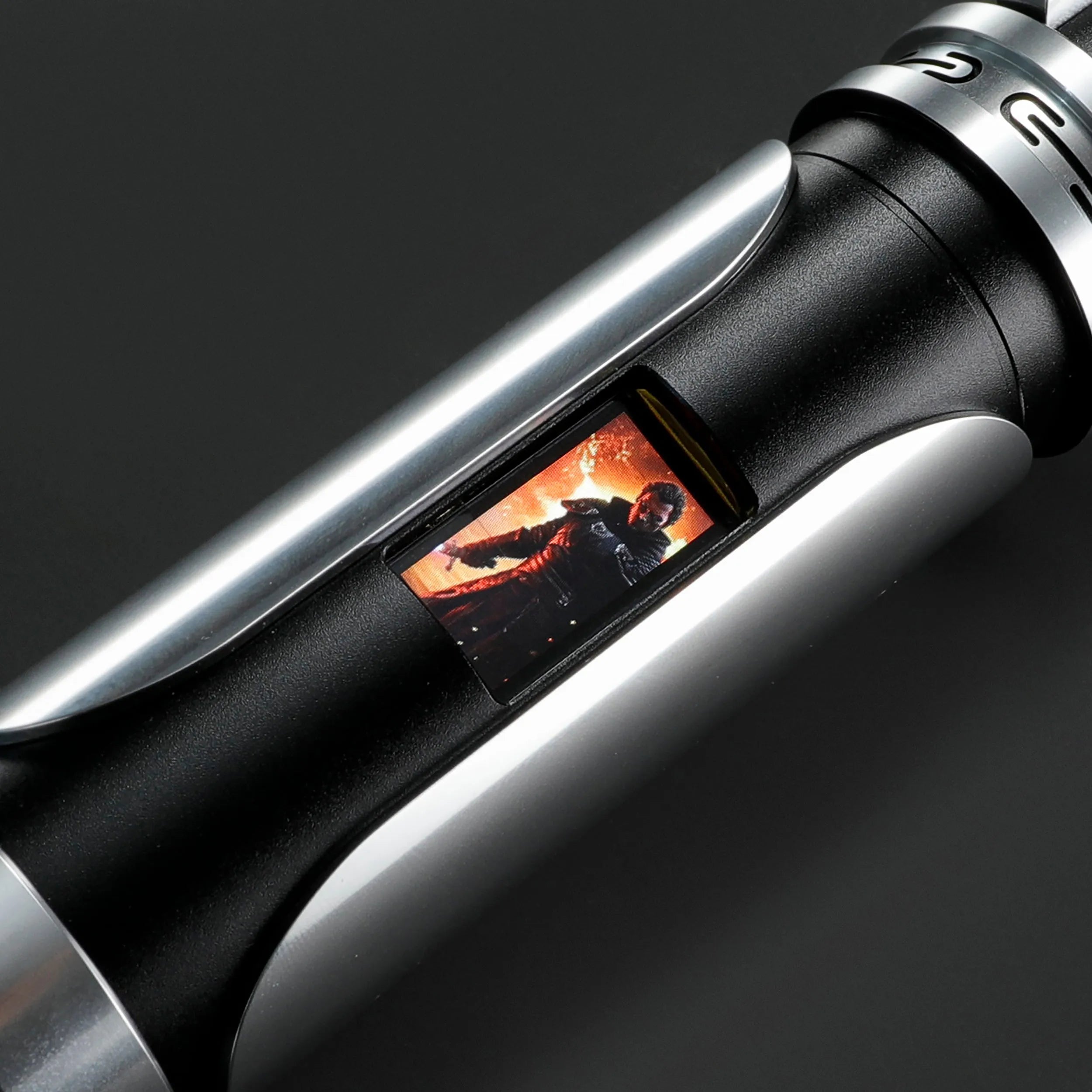Paragon Xenopixel V3 saber hilt with polished silver and deep black aircraft-grade aluminum, featuring an OLED display.