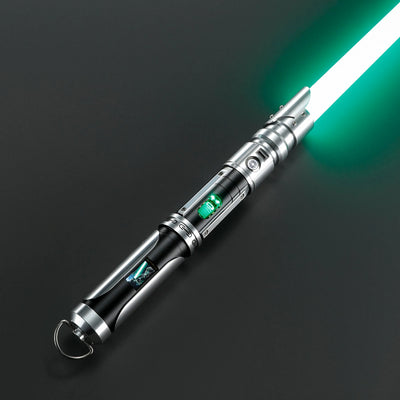 Paragon Xenopixel V3 saber with silver and black aircraft-grade aluminum hilt, exposed glowing kyber crystal, and green blade.