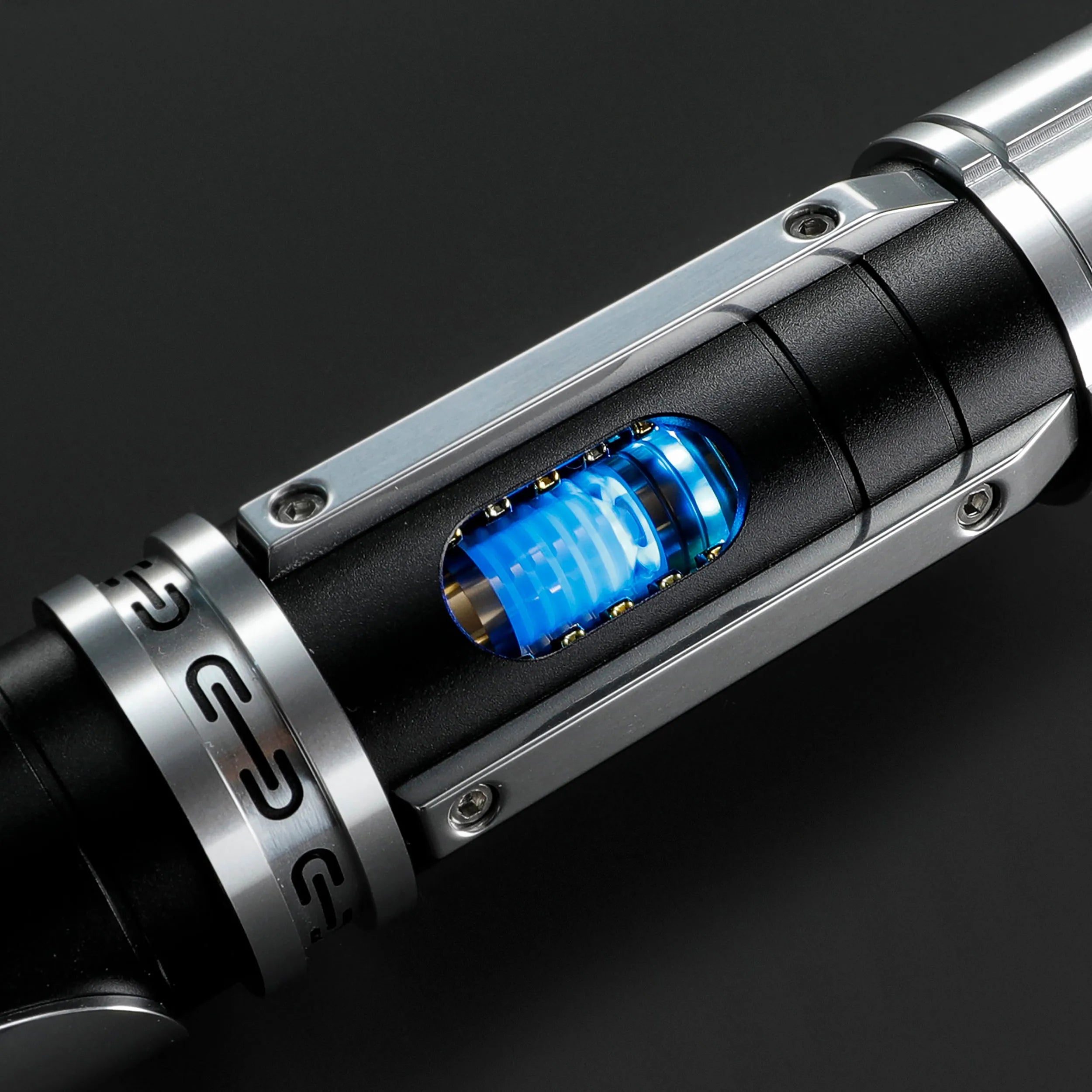 Paragon Xenopixel V3 saber hilt with exposed blue kyber crystal, polished silver, and deep black aircraft-grade aluminum.