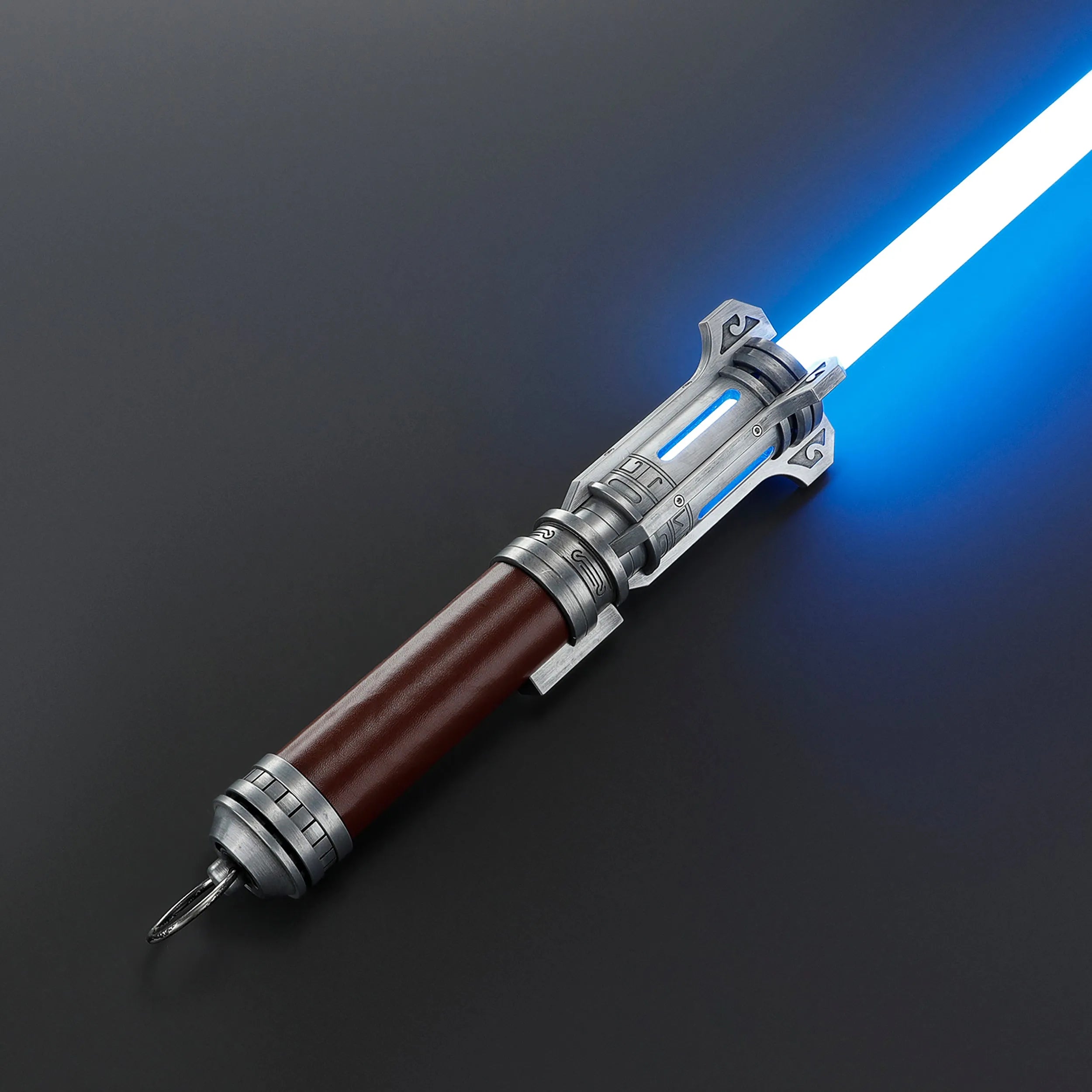 Pilgrim Ascendant Path Saber with a brown leather-like grip, silver hilt, and blue illuminated emitter.