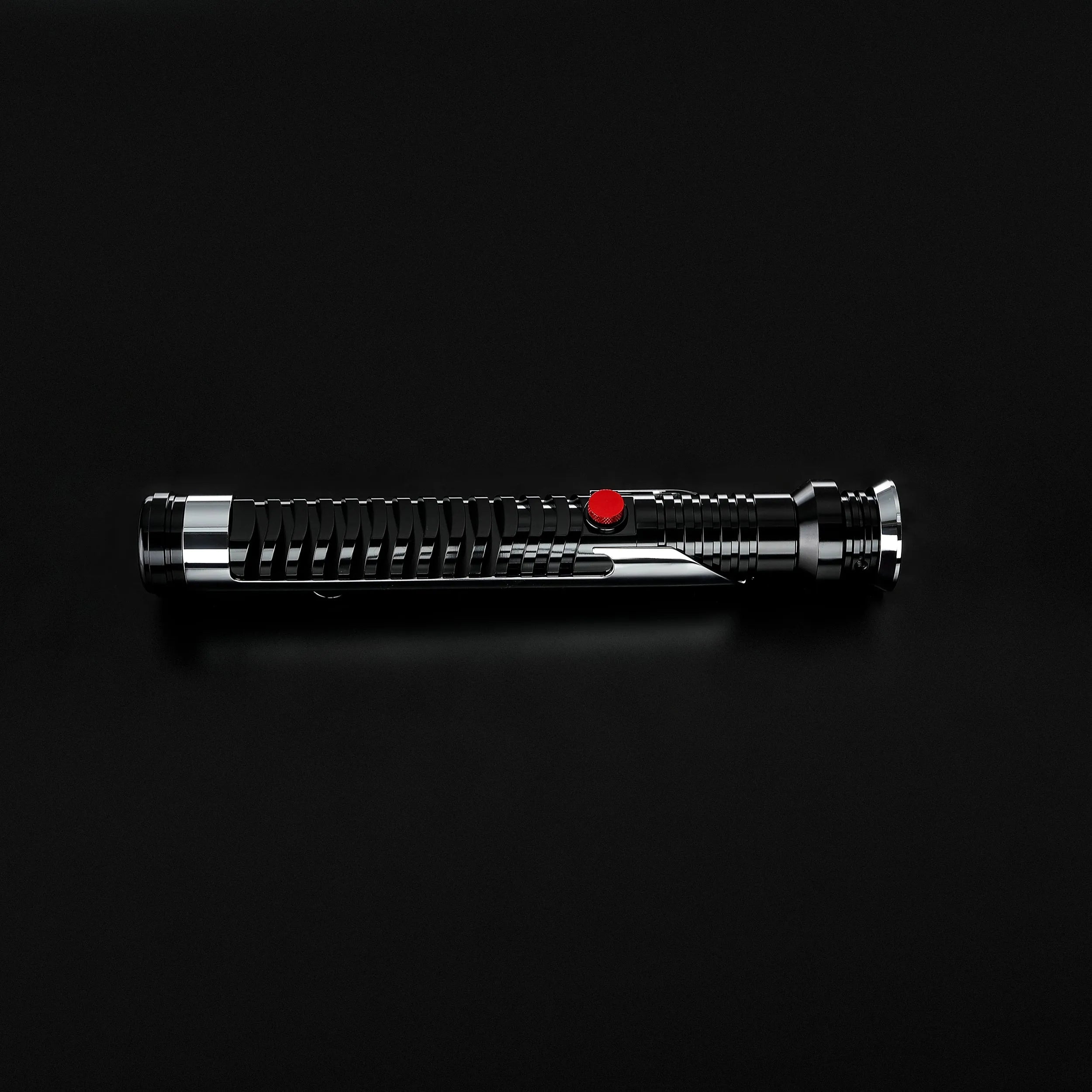 Qui-Gon Jinn lightsaber hilt, black and silver T60 aluminum with a prominent red activation button.
