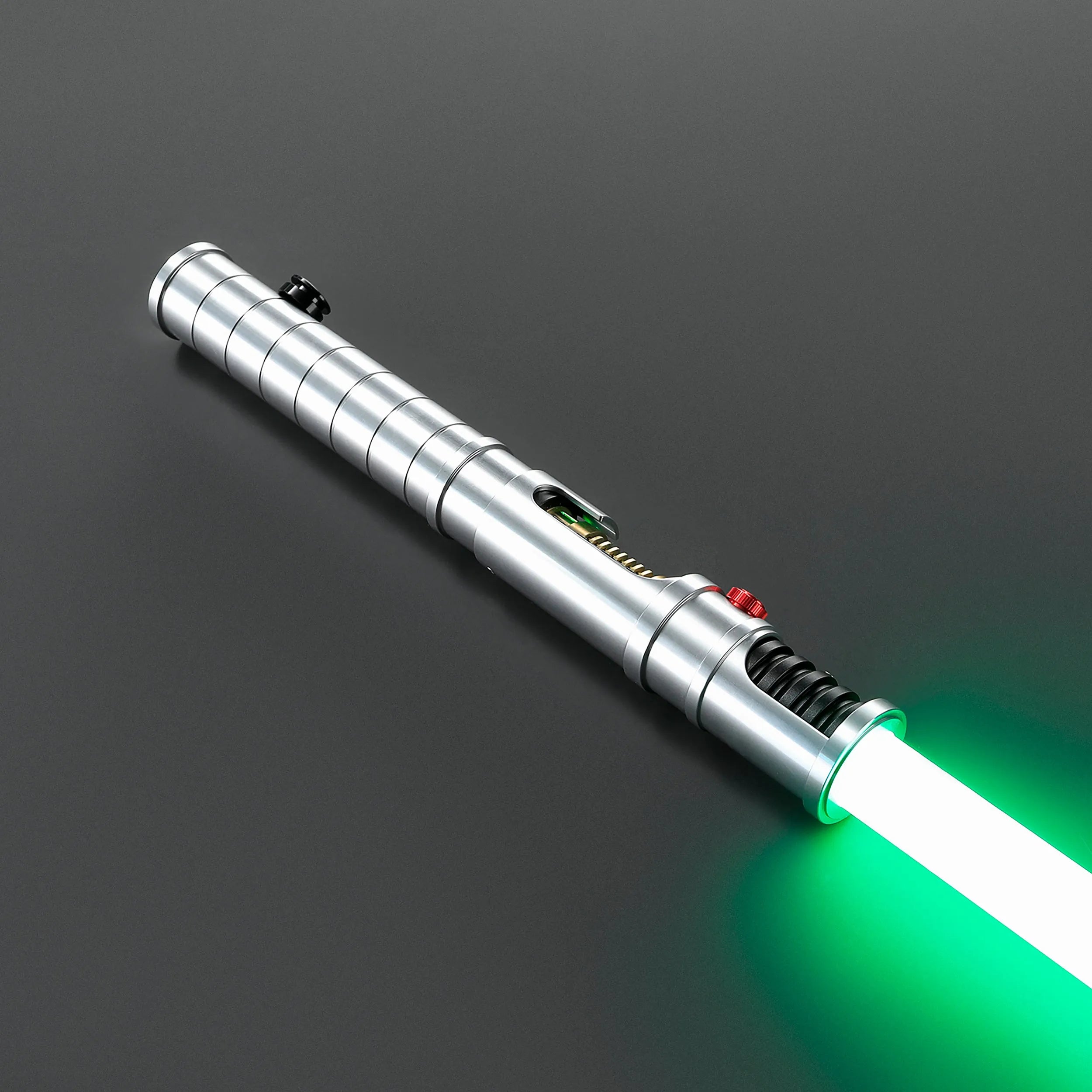Quinlan Vos Saber: Brushed aluminum hilt with a glowing green blade, exposed kyber crystal chamber, and minimalist Jedi design.