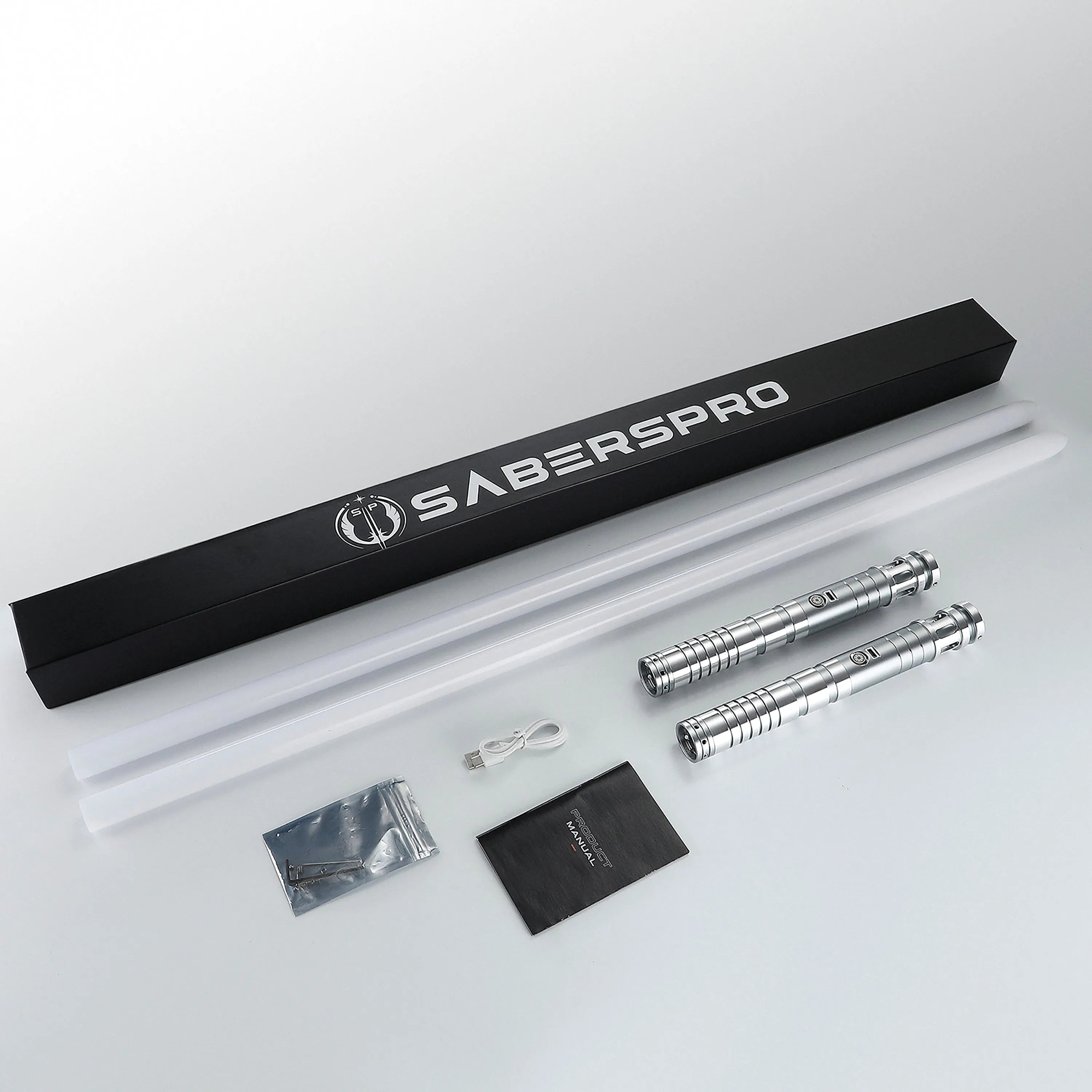 Sol bundle with two silver T6 aluminum lightsaber hilts, polycarbonate blades, charging cable, and manual in a box.