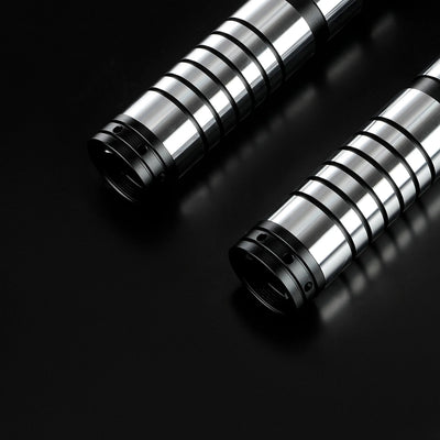 Two Sol lightsaber hilts crafted from sleek silver and black T6 aircraft aluminum on a black background.